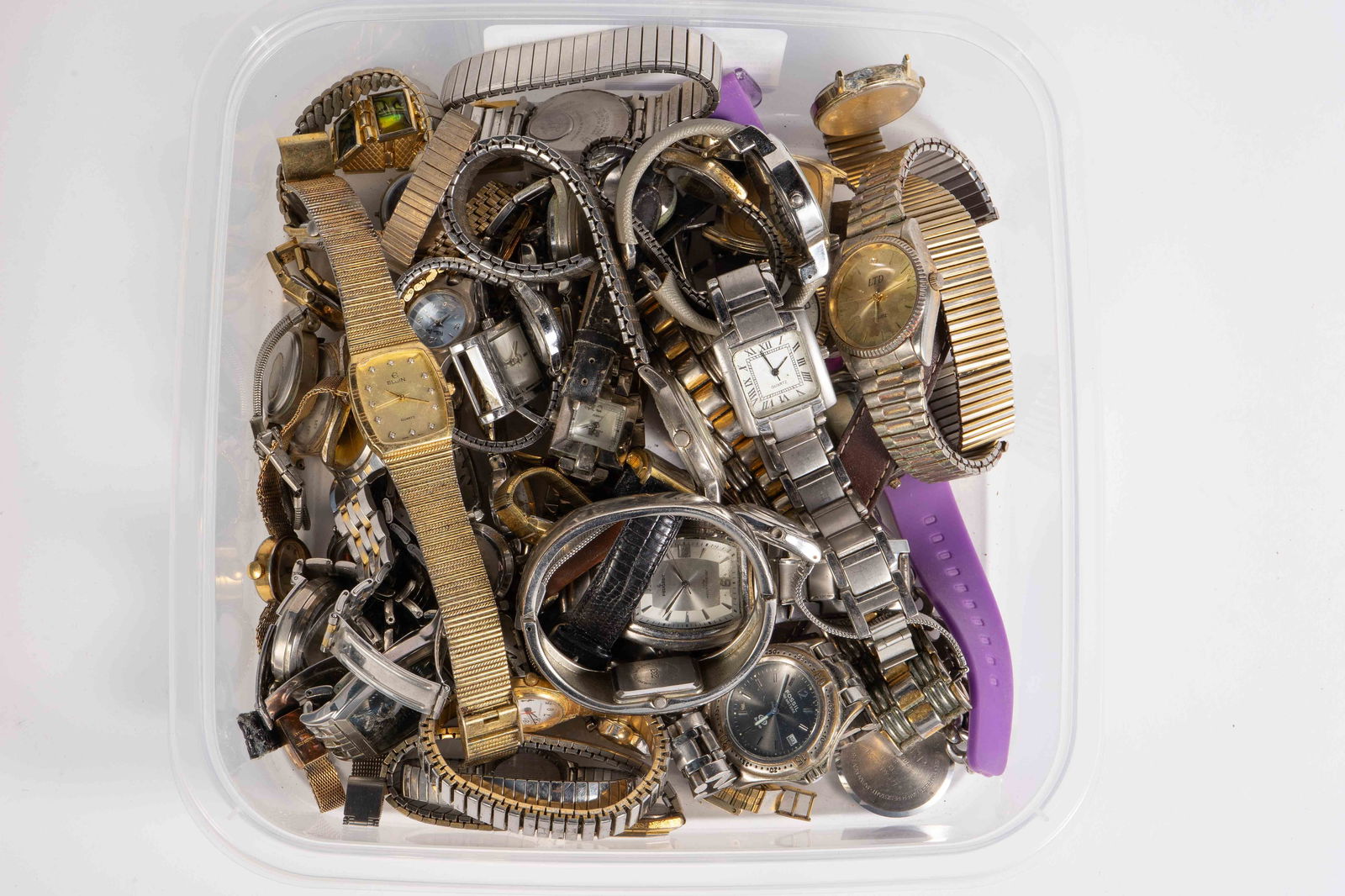 Lot of Wristwatches - Quartz, Elgin, Bulova.: The lot contains over 50 wristwatches, some of them missing the bands, backs, or other elements. Most of them are quartz, and will need new batteries. The brands included are Quemex, Enid de Luxe, Inf