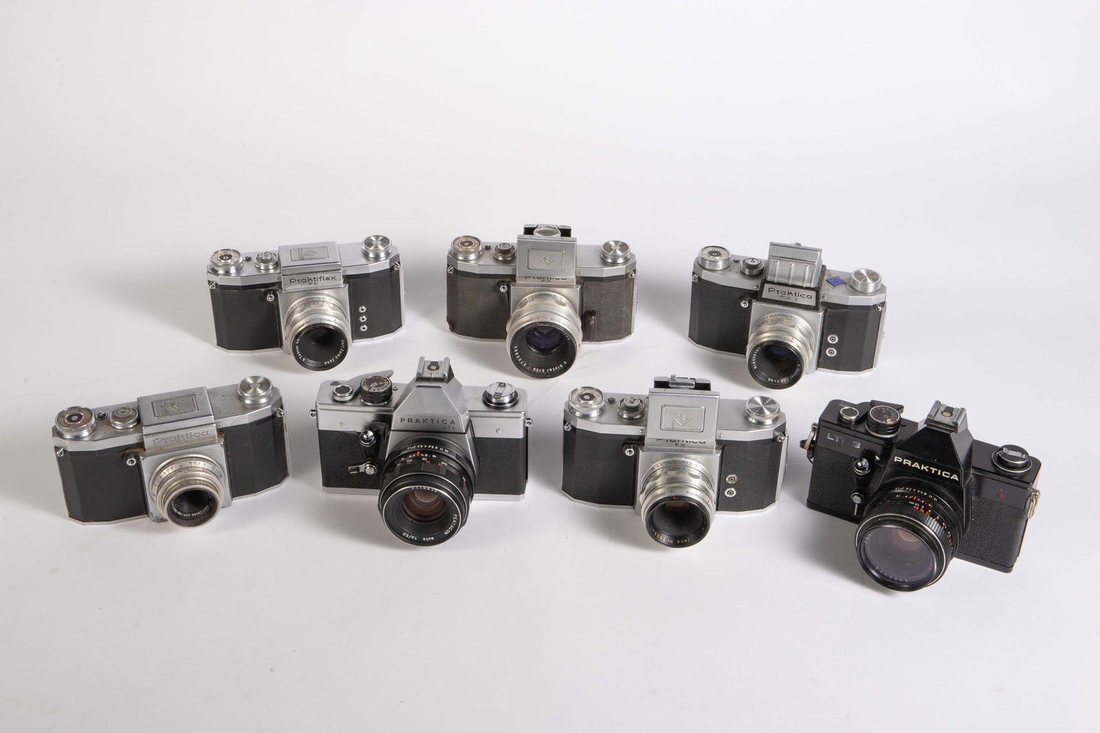 Lot of Praktica SLR cameras and Lenses.: This lot is made up of seven Praktica SLR cameras and seven lenses. Included is a Praktica FX with a Zeiss Jena Biotar 58mm f/2 lens, a Praktica LTL 3 with a Pentacon 50mm 1.8 lens, a Praktica FX with