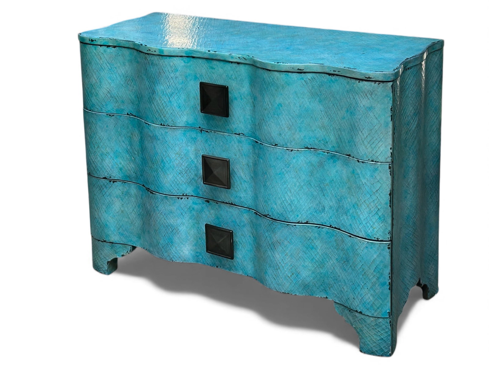 Hooker Furniture Melange Chest.: This turquoise crackle chest has a curved design, three drawers with floral interiors, and large pulls. It has two cutouts in the back. There are some scratches, and a bit of paint loss. Overall, it i