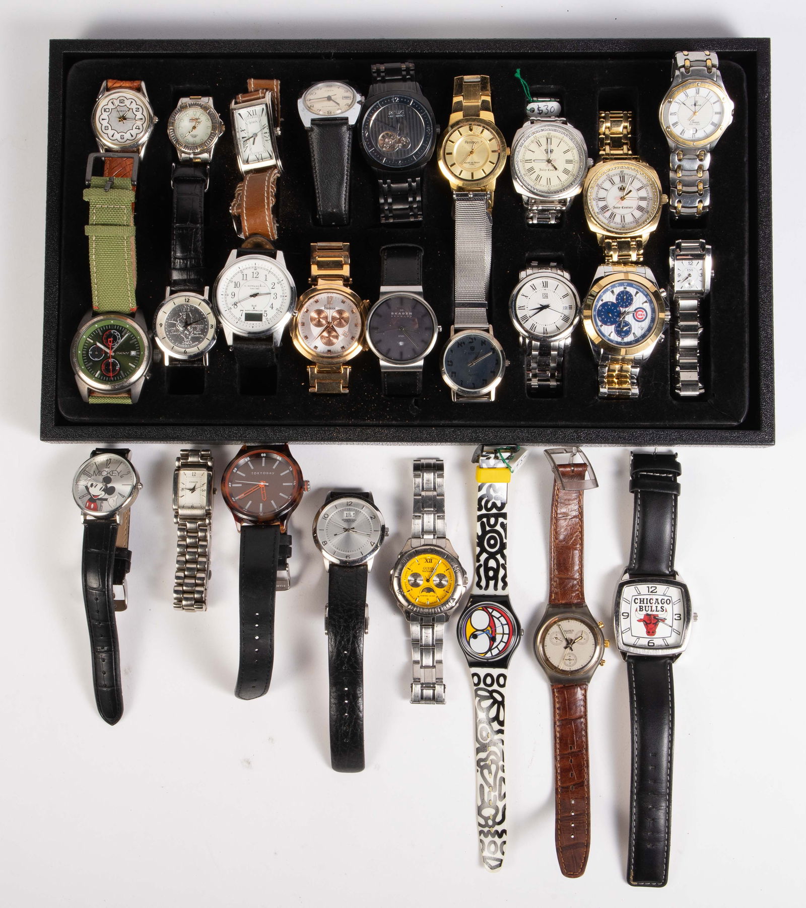 26 Wristwatches - Vintage, Coach, Skagen, ESQ.: The lot contains 26 mostly mens' and mostly quartz wristwatches. The automatic watches included are Timex, Relic, and CYMA Oceania, which is missing the knob. The first two are ticking. The quartz wat