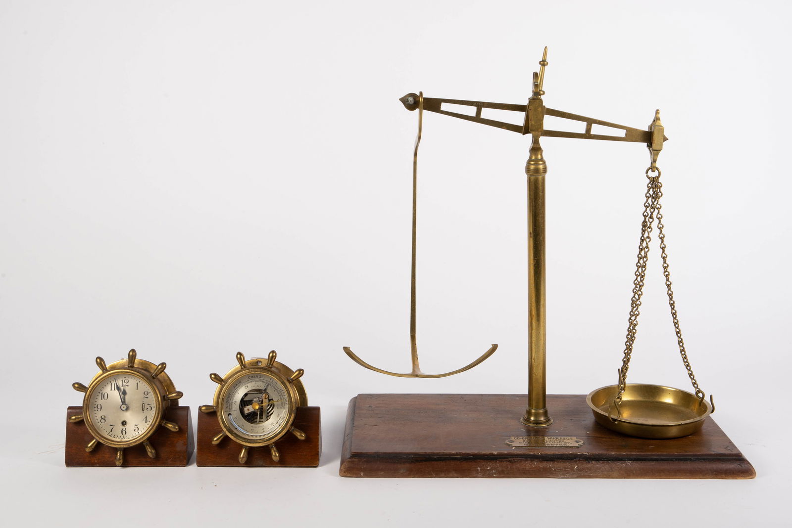 Antique Balance Scale & Chelsea Clock & Barometer.: The lot contains 3 items. First, there an antique brass and wood Class B balance scale by Co-Operative Wholesale Society Limited, Manchester. It is missing one of the scale pans. Next, there are two b