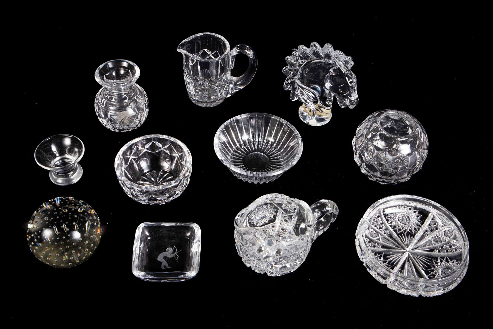 Lot of Assorted Crystal - Paperweights, Bowls, etc: The lot includes small bowls and trinket dishes, small pitchers, and paperweights. Overall, the lot looks to be in nice condition. The largest item measures 5 3/8" across and 1 1/2" tall. The smallest