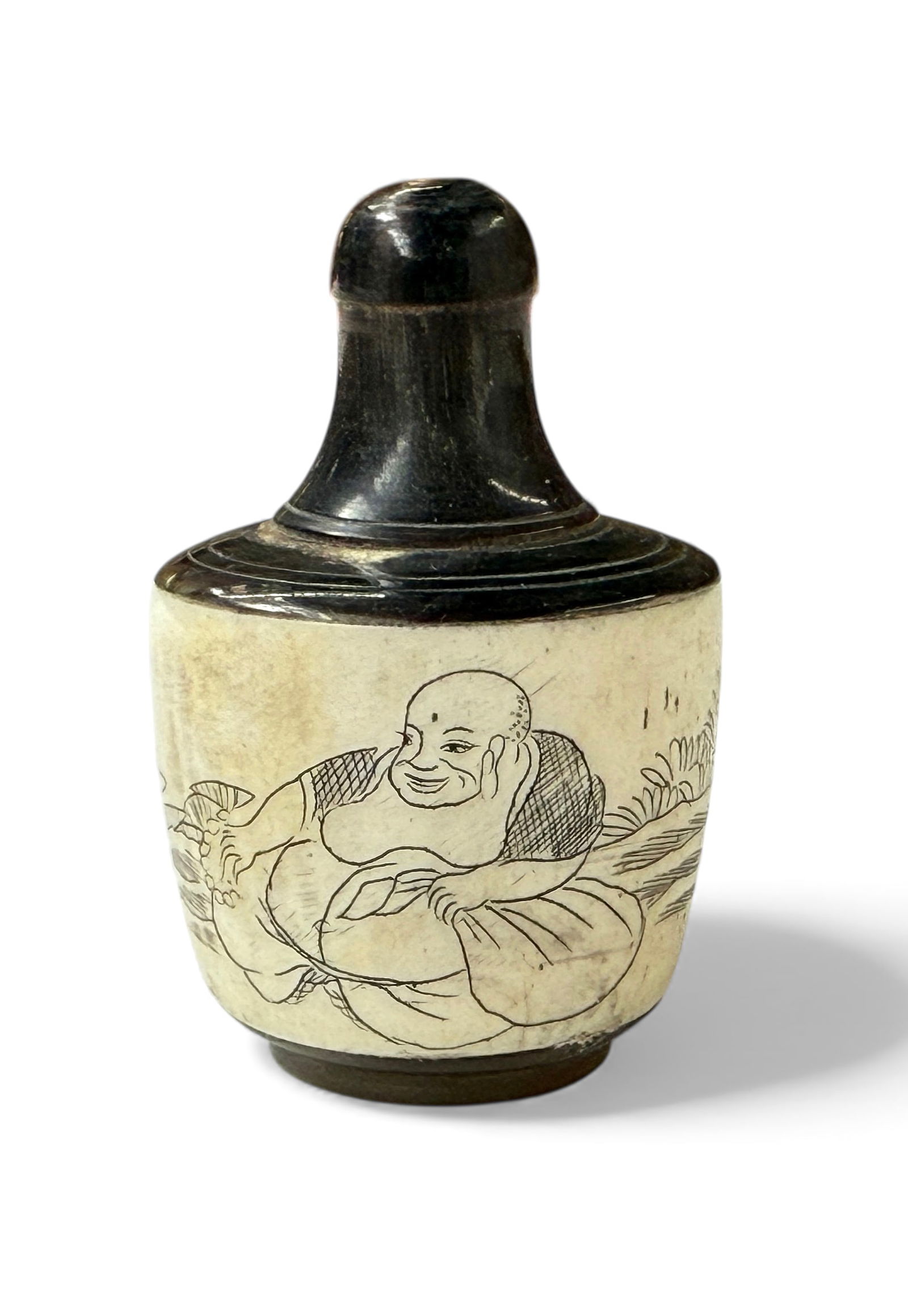Chinese Carved Buddha Bone & Horn Snuff Bottle.: The stopper is stuck in the bottle. Otherwise, it is in good overall condition, with wear to use. It measures 2 1/8" tall and 1 1/2" in diameter. In-house shipping is available. Please see our website