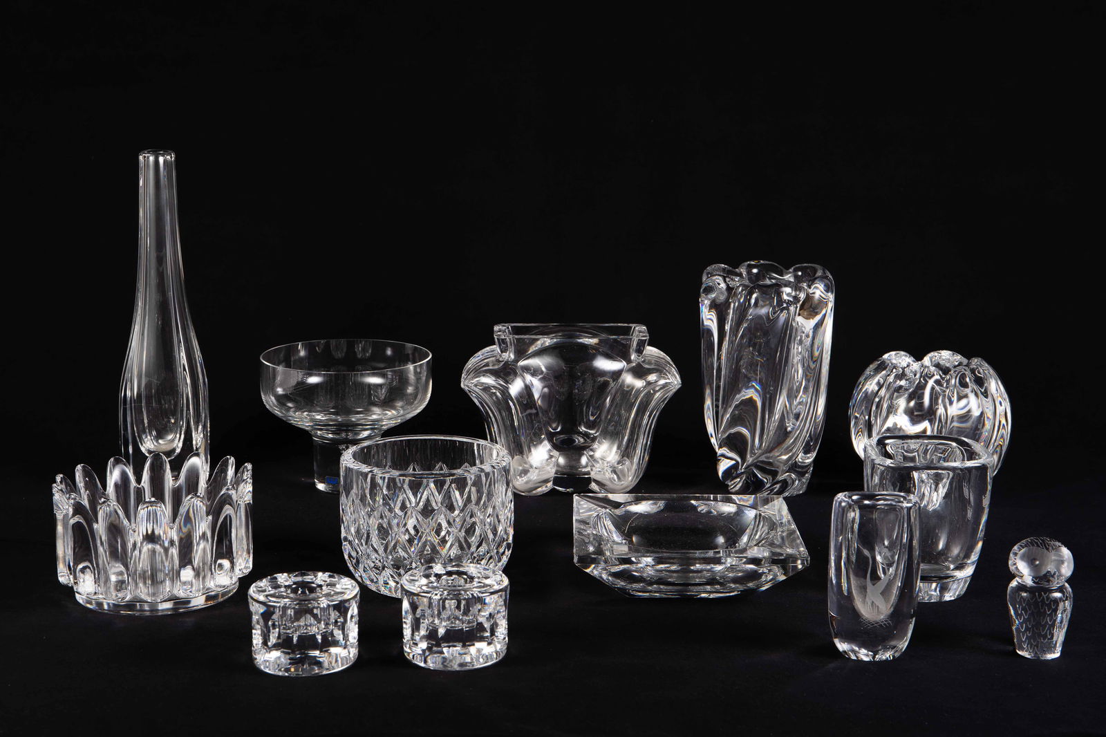 Lot of Crystal: Kosta, Orrefors, Val St. Lambert.: This lot includes vases, bowls, an ashtray, a paperweight, and a pair of candle holders. The brands include Orrefors, Kosta, and Val St. Lambert. Overall, the lot looks to be in good condition. The la