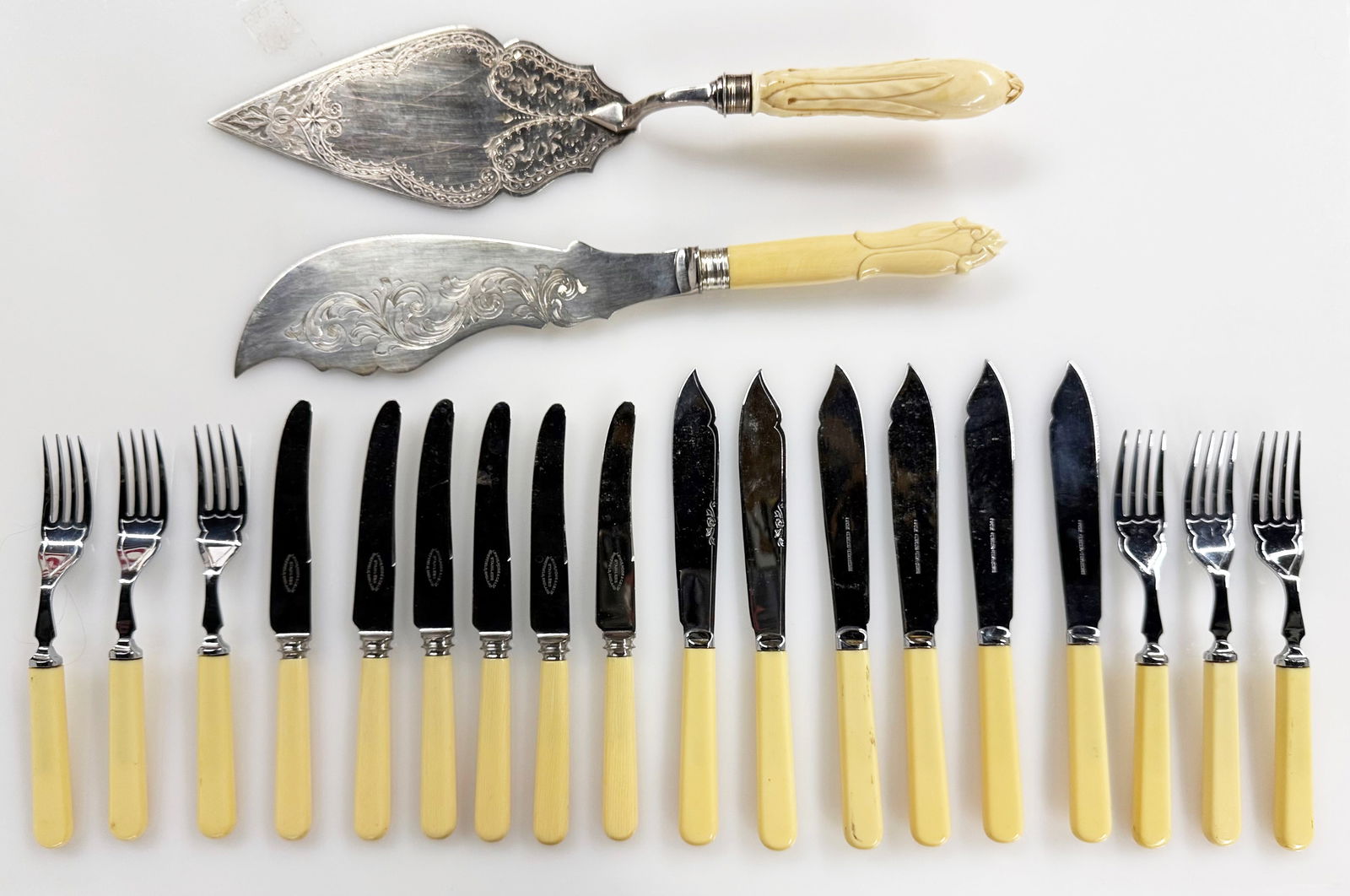 Lot of Bone Handle Flatware & Servers - 925, Etc.: The lot contains 22 items. The servers included are etched. There is a carving set, a cake server, and a fish fork. The lot also includes 6 table forks and 12 knives. Some of the marks observed are WH
