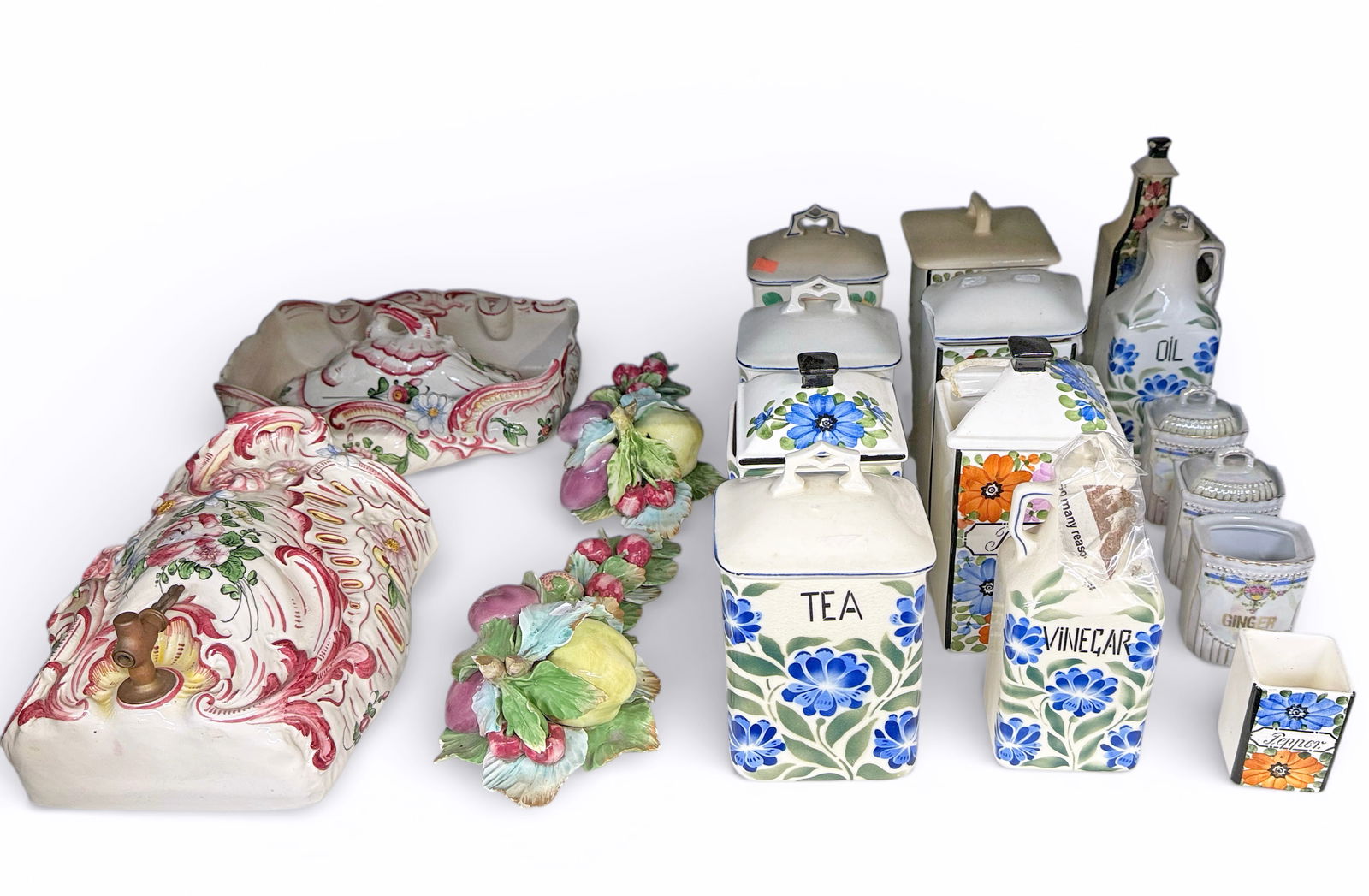 Lot: Ceramic Spice Jars, Majolica Fountain, More.: The lot contains 17 items. First, there are 11 spice jars and three oil or vinegar cruets. Next, there is a small French Majolica wall mounted water fountain with a basin and a lid. Finally, there are