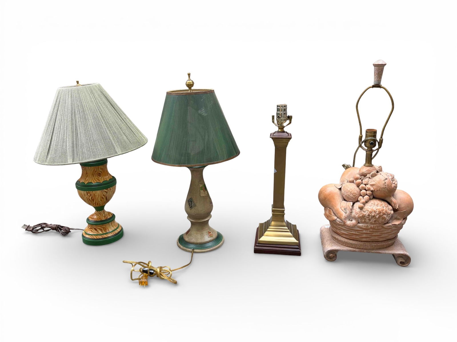 Lot of 4 Table Lamps, inc. Marbro Ceramic.: The lot contains 4 table lamps. The only branded piece is a Marbro Lamp Company piece with a ceramic fruit basket base. The lot also contains a brass column lamp, a novelty piece with stamps on it, an