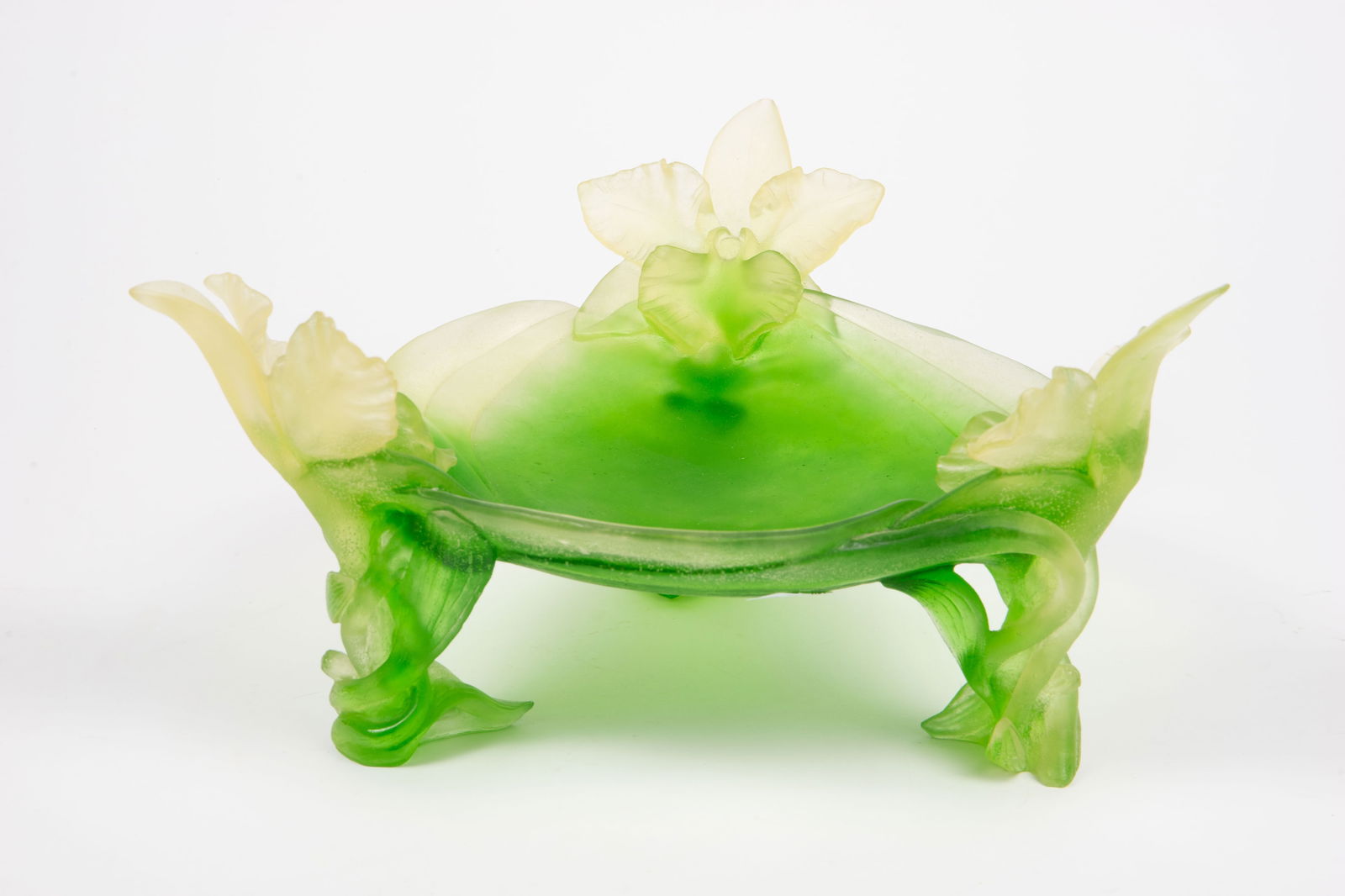 Daum Pate de Verre "Orchidee" Footed Bowl.: This footed green centerpiece bowl has three large orchid flowers. Overall, it looks to be in nice condition, with some dust in the recesses. It measures 13" x 13" x 6 1/2". Third-party shipping or pe