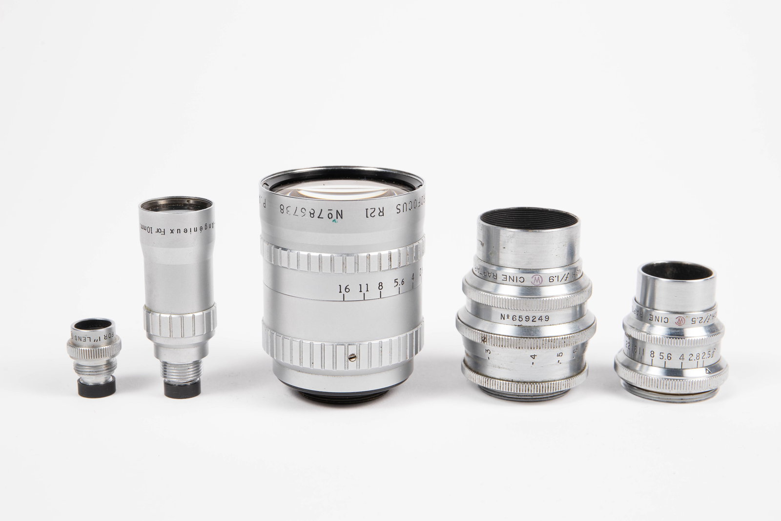 3 Vintage C-Mount Lenses - Angenieux, Wollensak.: Included in the lot are the following cinema / movie camera lenses: a P. Angenieux 10mm f/1.8 Retrofocus R21 Lens (sn 786738) with matched finder, a Wollensak Cine Raptar 1 inch f/1.9 Lens (sn 659249)