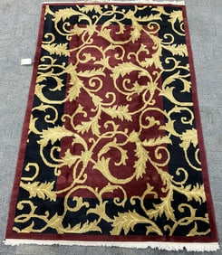 5' 6" x 8' 8" Red, Yellow & Blue Tibetan Rug.