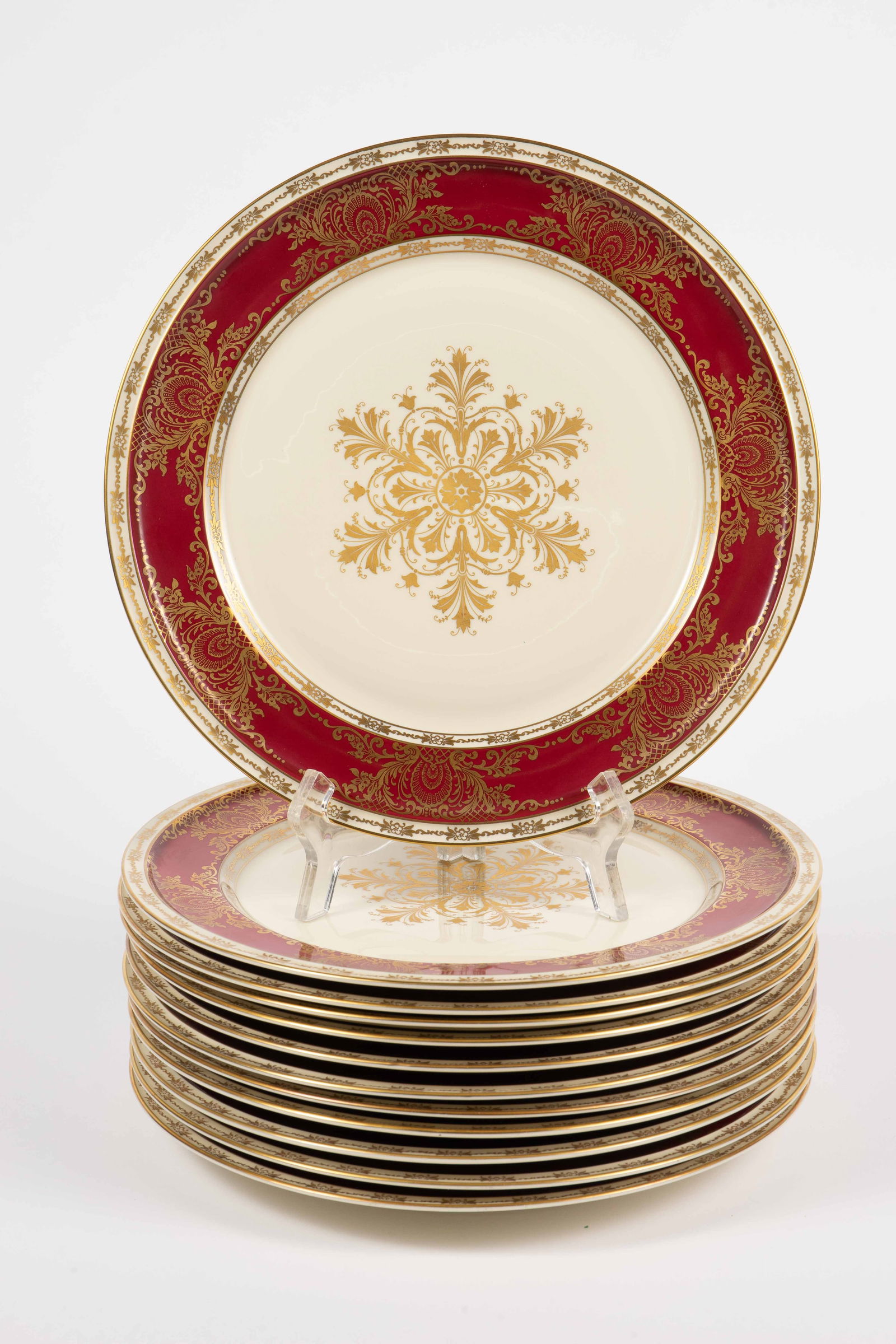 12 Rosenthal "Sir Christopher" Dinner Plates.: These elegant dinner plates have a central gold colored snowflake design, making them ideal holiday dishes. Each plate measures 11" in diameter, and looks to be in nice condition. In-house shipping is