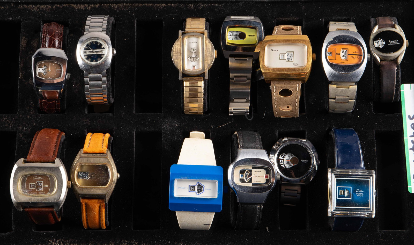 Lot of Mostly Jump Hour Watches - Sicura, Tissot.: The lot contains 13 vintage watches, 12 of them Jump Hour. The non jump hour watch is a Tissot automatic T.12 with a blue face. The jump hour watches included are Lord Nelson, Citizen 1481010, Chateau