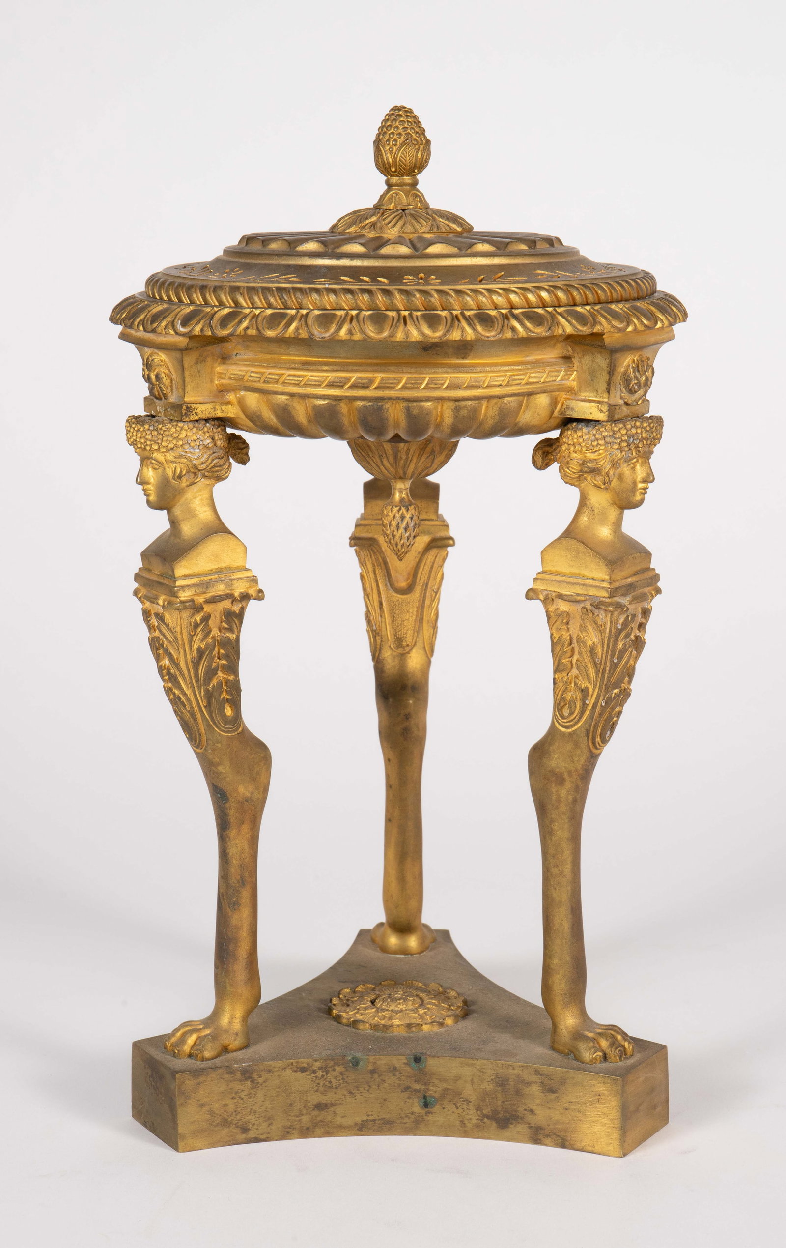 Gilded Bronze Lidded Tazza w/ Neoclassical Faces.: This pawfoot tazza has three ladies' faces sitting atop the legs, supporting a round bowl with a pierced lid. There are some stains and signs of surface wear, but overall, the lot looks to be in good 