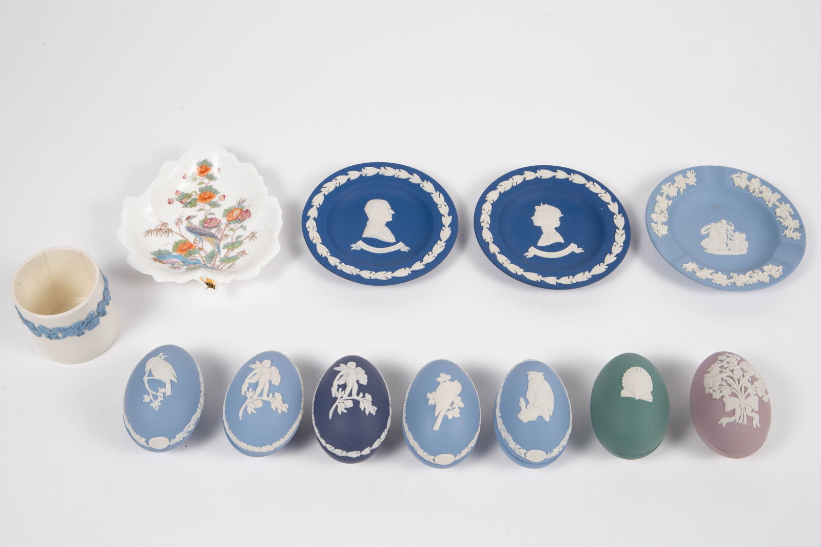 Lot of Wedgwood Trinket Boxes and Dishes.: Most of them are Jasperware egg boxes and ashtrays or round dishes. There is also a Kutani Crane leaf-shaped dish, and a Queensware toothpick holder (this item has cracks). Overall, the lot looks to b