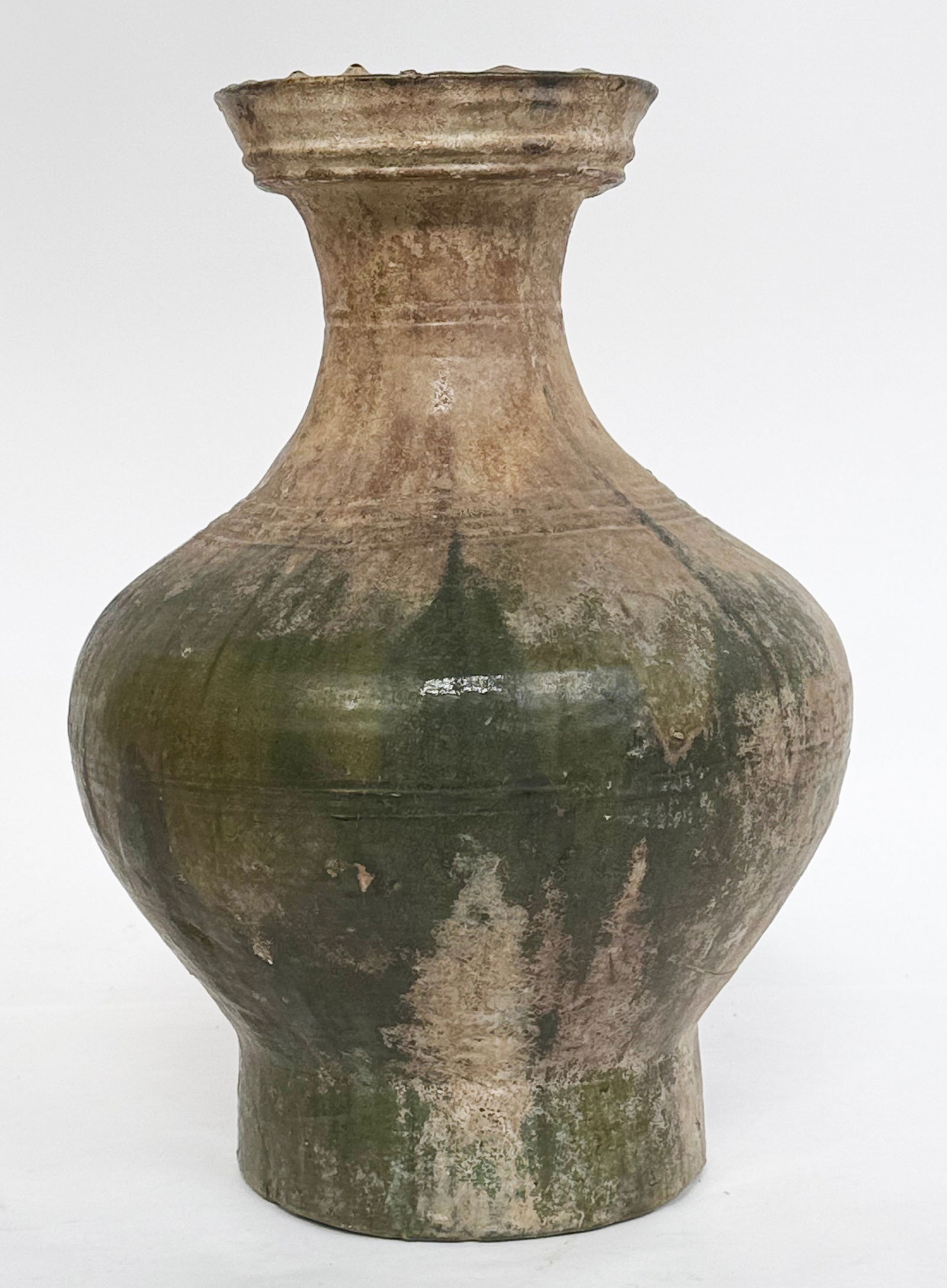 Possibly Han Dynasty Green Glaze Hu or Wine Jar.: The large jar has an age crack or crack when produced near its base. It looks to be in good overall condition. The earthenware jar measures 17 3/8" tall and 12" in diameter at its widest point. It com