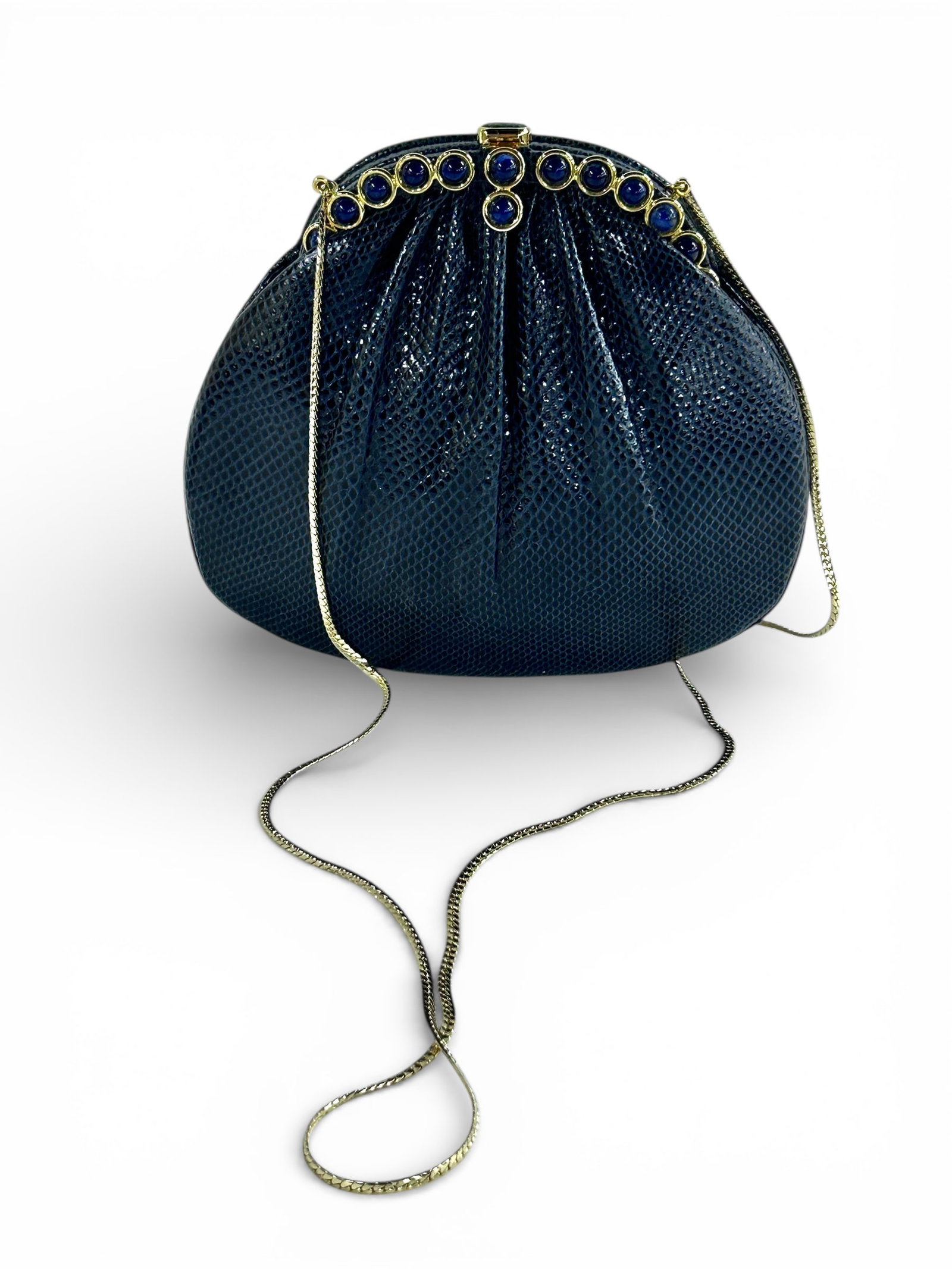 Judith Leiber Black Lizard Handbag.: It comes with an optional gold tone shoulder strap. The beads resemble dark blue gemstones, with gold tone hardware. Also included are a small coin purse and two dust bags. Overall, the lot looks to b