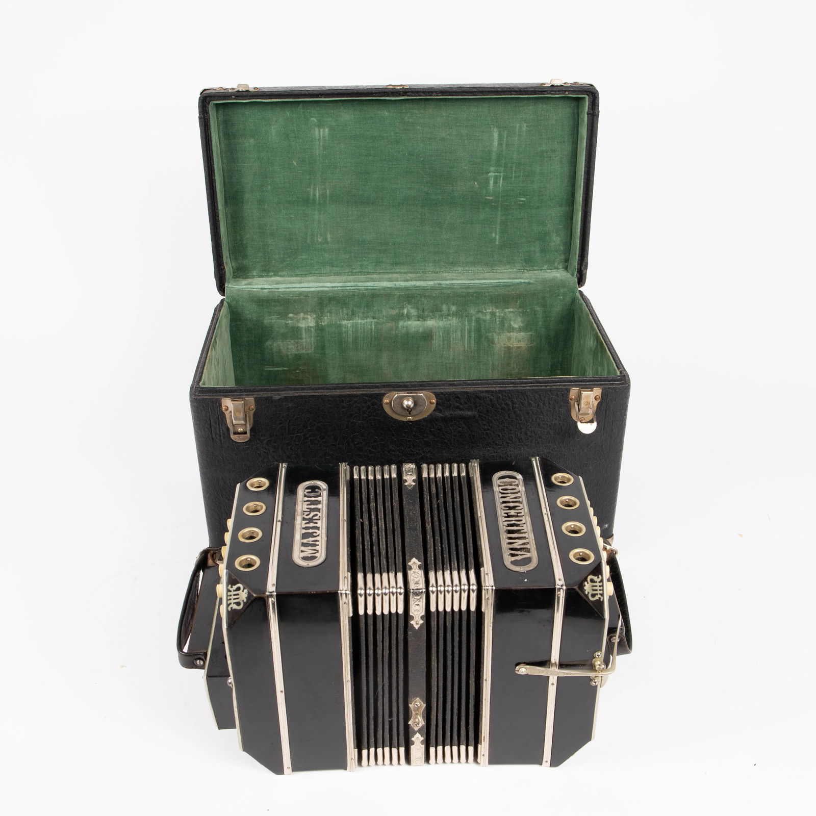 Majestic Concertina Instrument in Case.: The antique concertina instrument by Majestic is branded beautifully, and marked Made in Germany. The black instrument has ornate pierced carvings, and measures 14 1/4" x 7 1/4" x 8 1/8". The case mea
