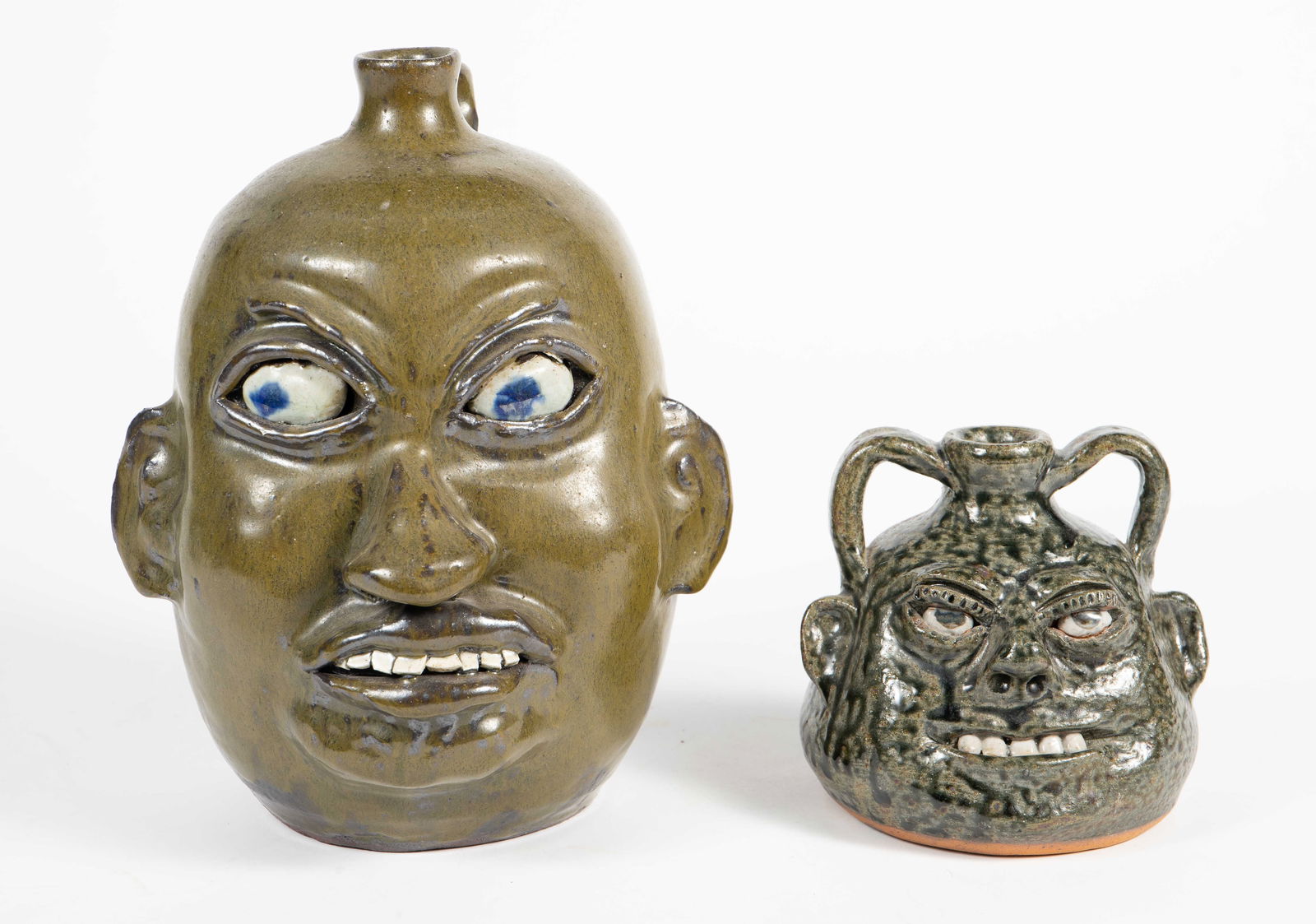 Lot of 2 Signed Grotesque Face Pottery Jugs. (1 of 5)