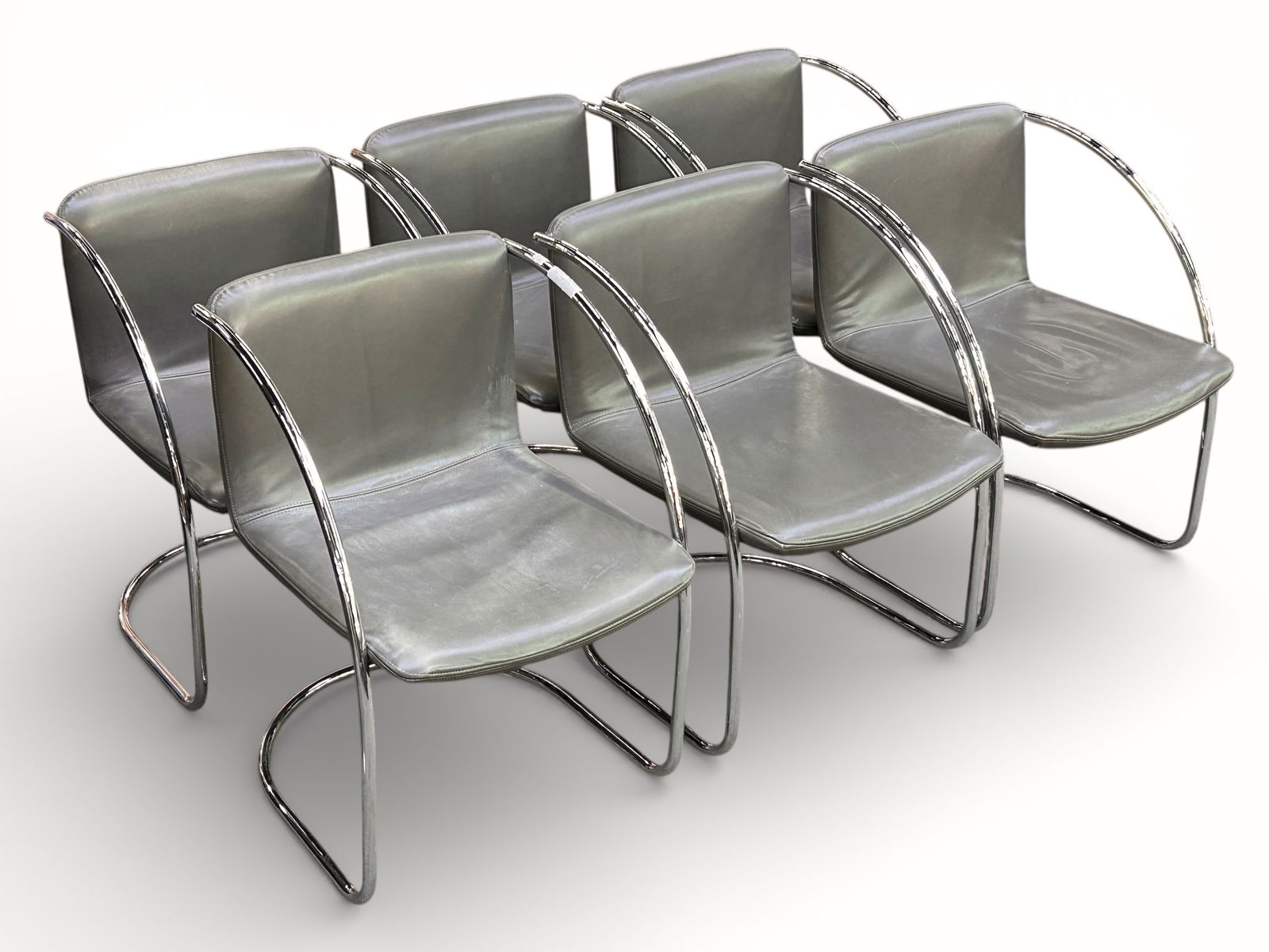 6 Giovanni Offred Leather & Chrome Lens Chairs.: The lot consists of 6 chairs designed in 1968 by Giovanni Offred for Sapority Italy, and titled "Lens". They have a chrome tubular base with gray leather seats with a stitched border. They measure 30"