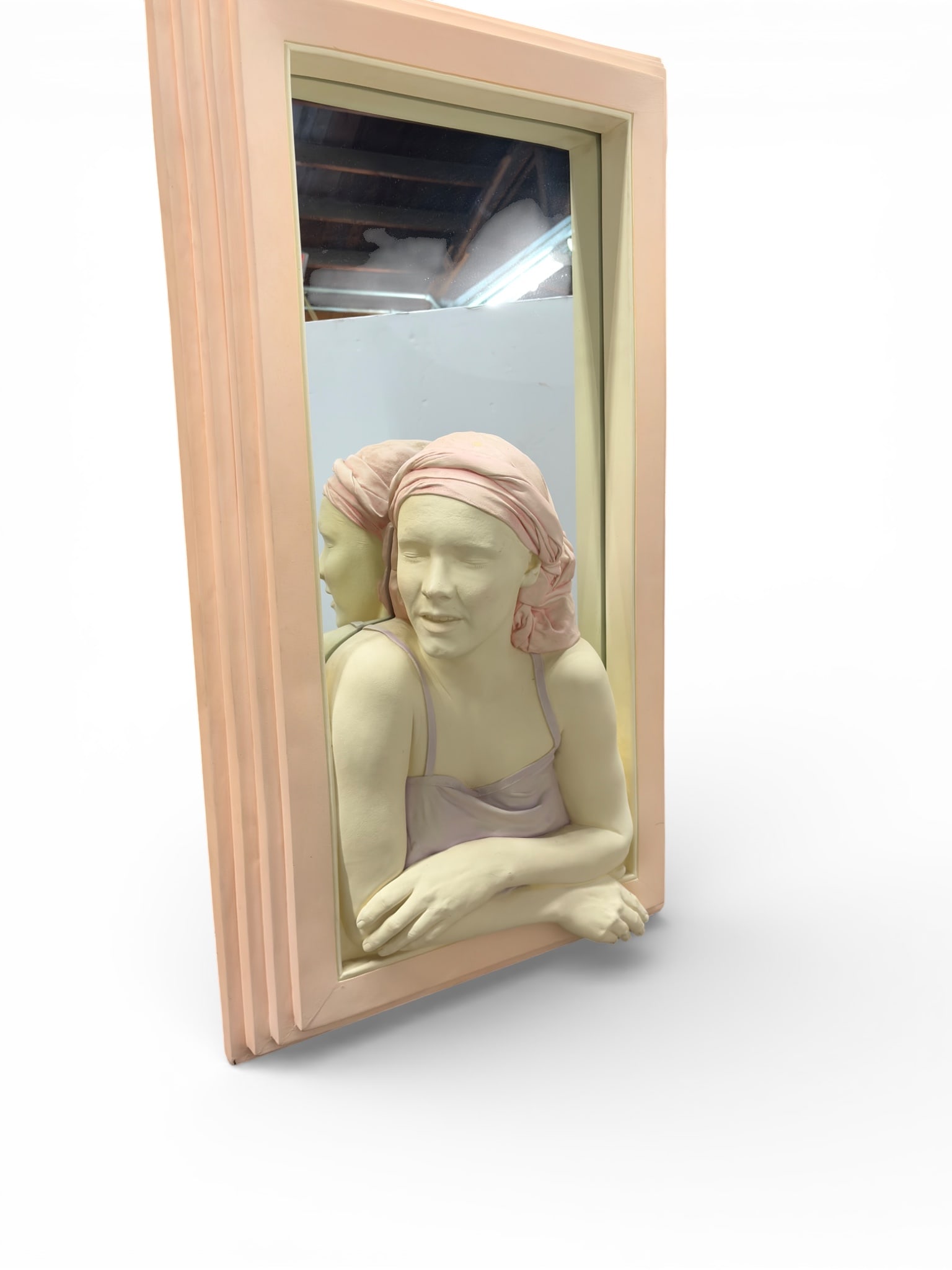Marc Sijan Mirror Sculpture "Girl in Window", 1986: The rectangular mirror is signed Marc Sijan, titled "Girl in Window", dated 1986, and numbered 13/100 on the back. It has a pink tiered frame, and the bottom section holds a bust sculpture of a woman