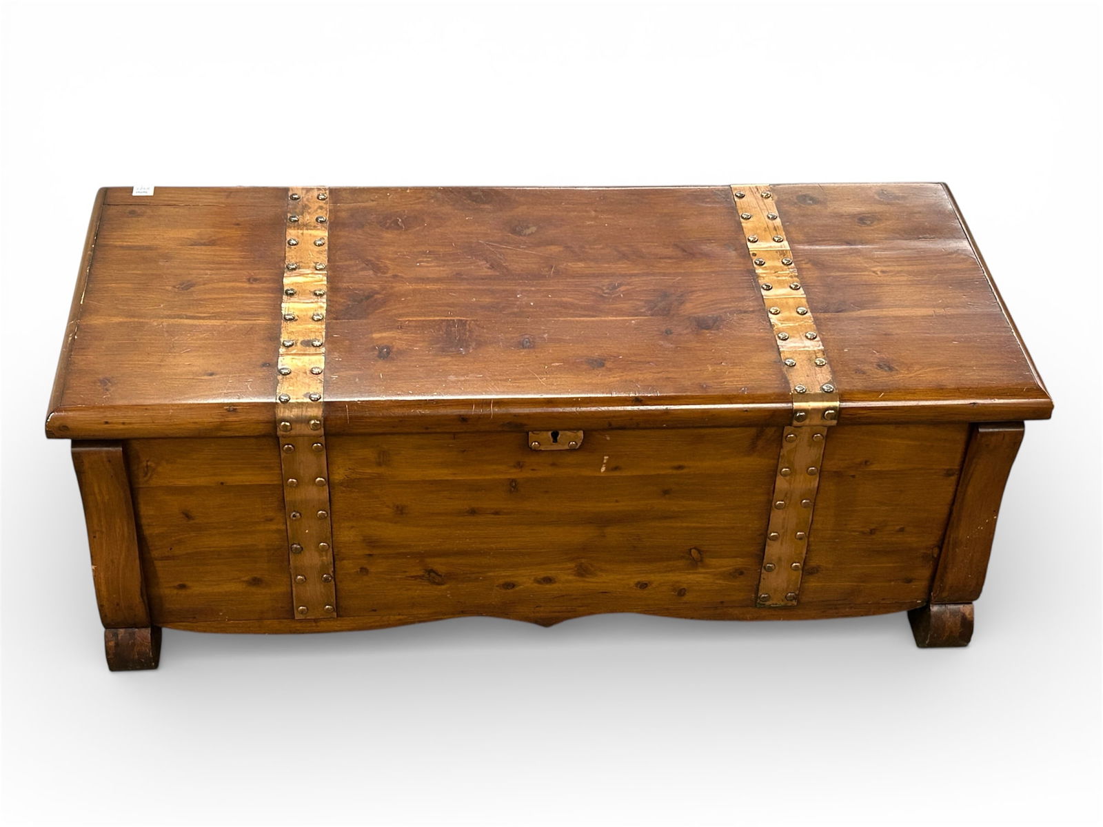 Vintage Cedar Chest.: The chest has copper mounts with nailhead design and side handles. There are a few scratches, but overall, it is in good shape. The piece measures 43 1/2" wide, 19" deep, and 17" tall. Third-party fre