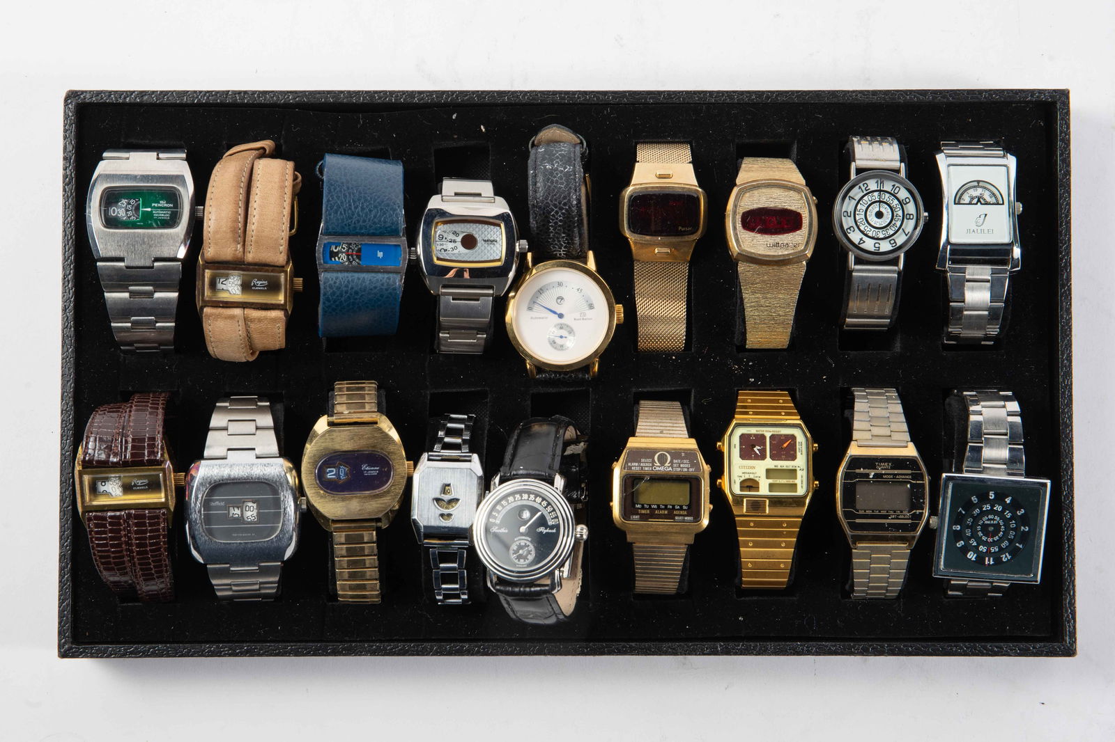 18 Vintage Jump Hour & Digital Watches- Lip, Omega: There are 8 jump hour watches, including Pencron 17 jewels, Etienne 17 jewels, Sheffield, Lip, Regina 17 jewels, and Citizen 1481010. The 4 digital watches included are Pulsar, Wittnauer, Omega Memoma