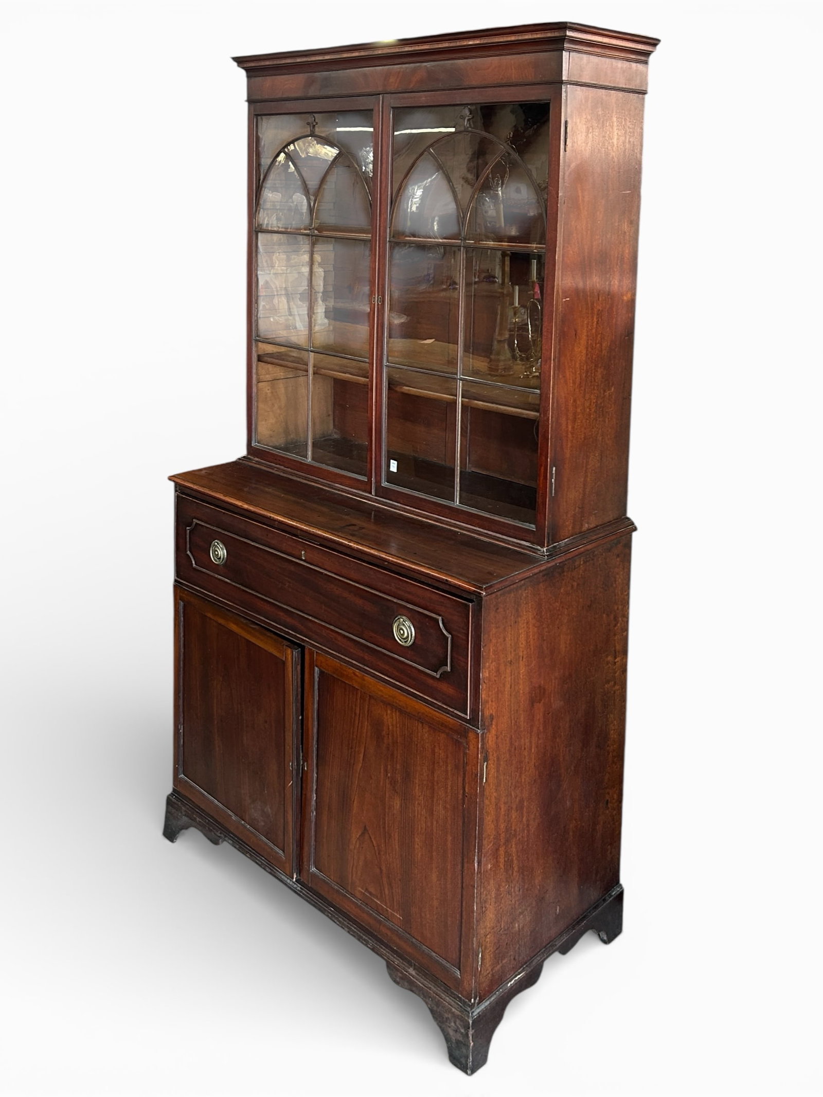 Georgian Style Flame Wood Breakfront Secretary.: This George III style piece has two glass doors with fretwork, two adjustable wooden shelves, and a lower pull-out desk drawer with a writing surface, six small interior drawers, and cubby holes. The