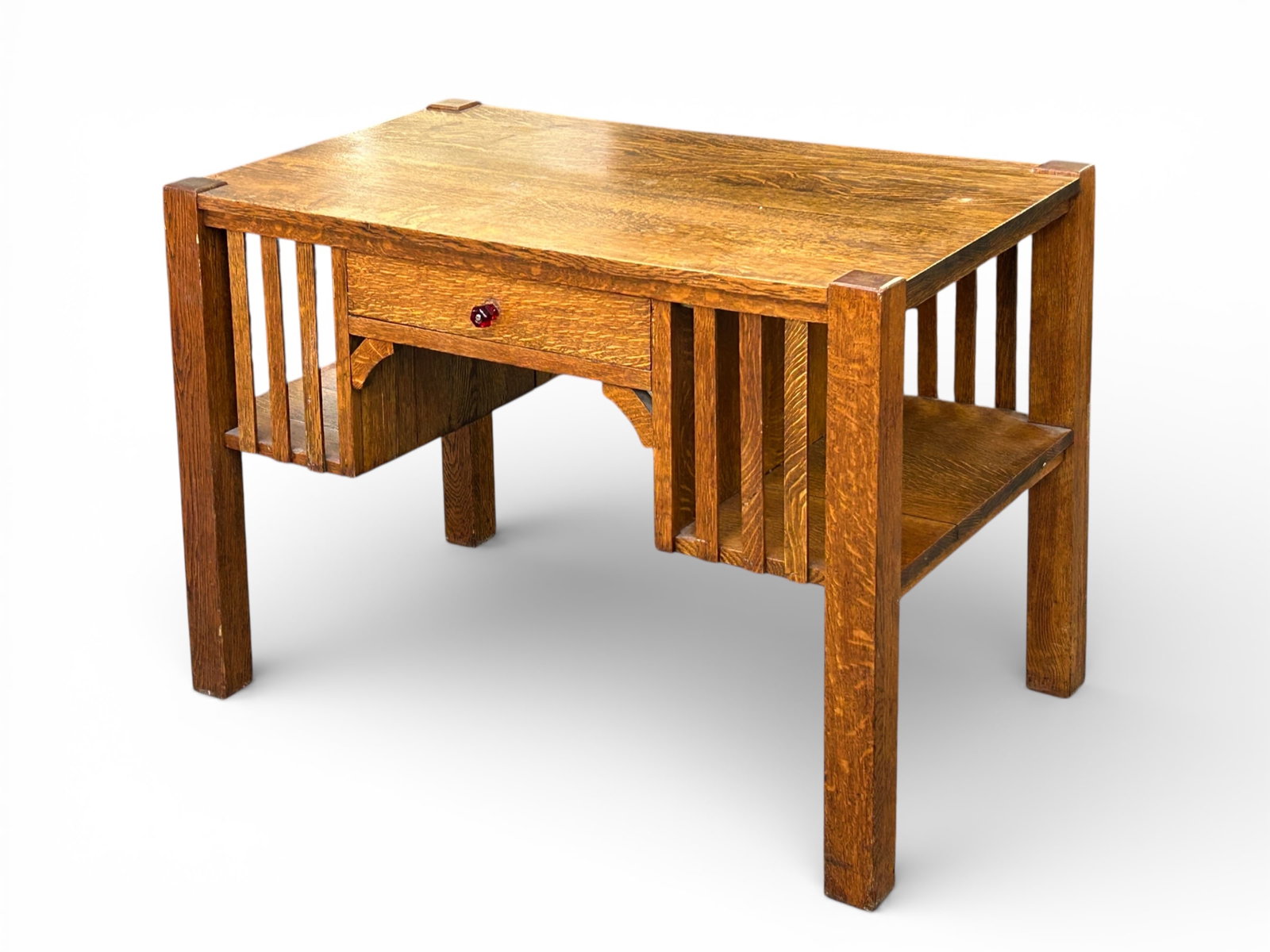 Arts & Crafts Mission Style Quartersawn Oak Desk.: The desk has one drawer, a slatted front and back, and bookcase shelves on each side. The drawer handle has been replace with a newer pull. The desk measures 29" x 41 1/2" x 21 1/2". The stationary