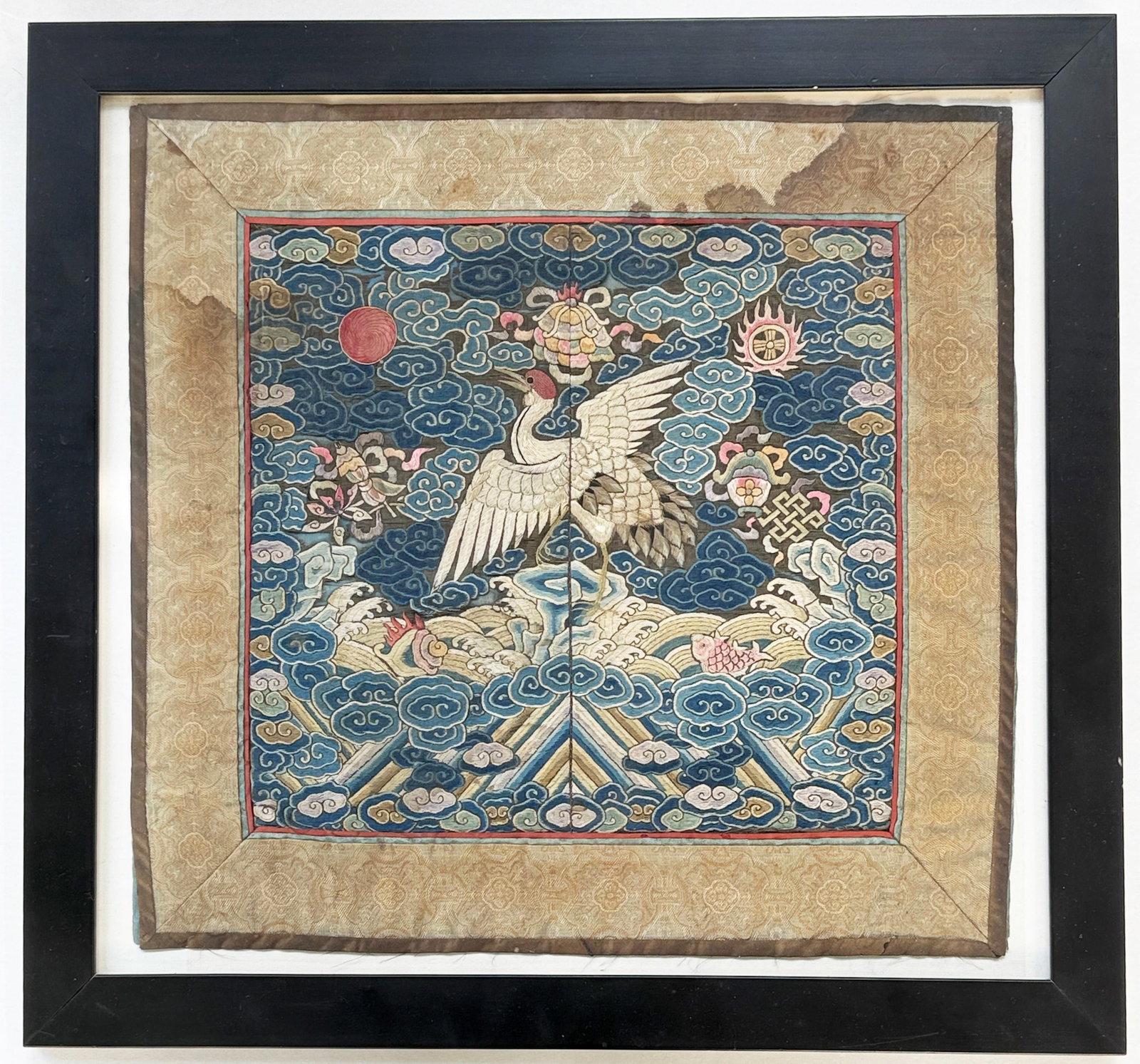 Chinese Qing Dynasty Embroidered Silk Rank Badge.: The piece has some stains. Otherwise, it looks to be in good overall condition. It is housed in a frame protected by glass. The badge measures 13 1/2" x 13 7/8". The frame measures 16 1/2" x 17 1/2"