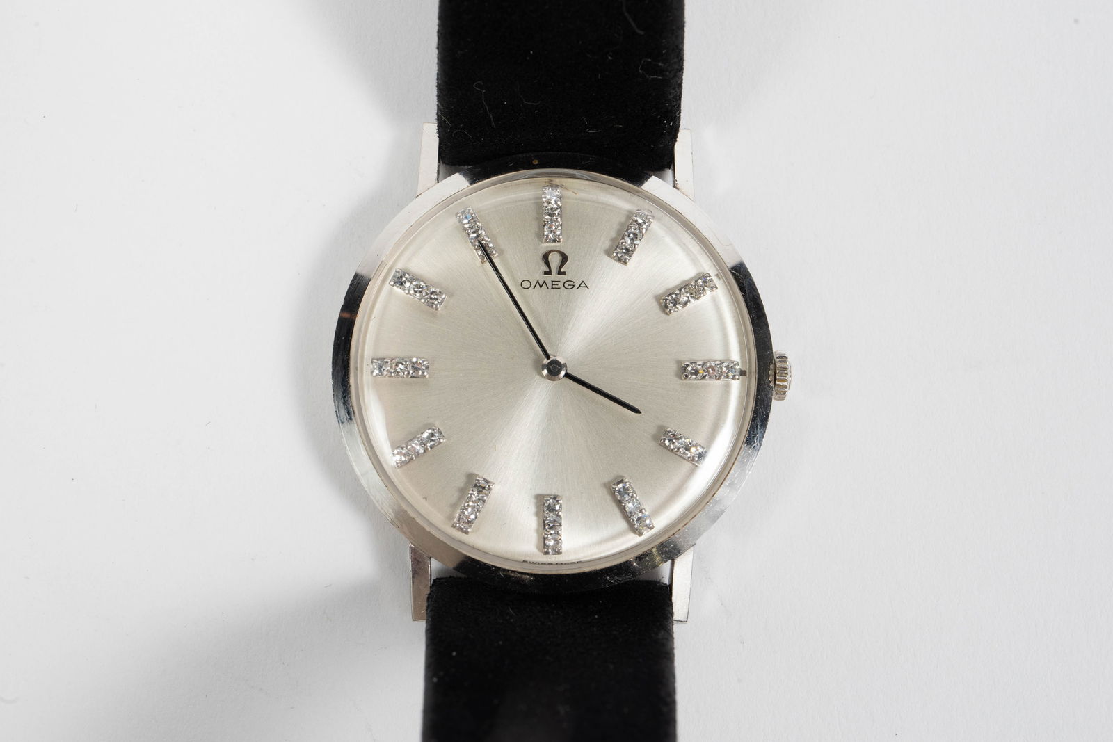 Omega 14K White Gold Diamond Vintage Watch.: The automatic watch features three small round brilliant diamonds on each hour marker. The 33mm case is marked 14K on the back. The piece has a black suede leather band. It ticks. The entire timepiece
