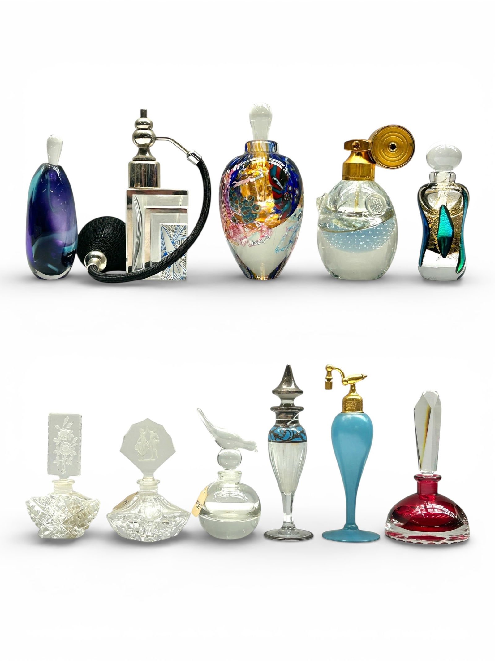 11 Glass & Crystal Perfume Bottles inc. Atomizers.: The lot contains 3 atomizers and 8 perfume or scent bottles. A few of the art glass bottle are signed. The signatures observed are Fox, Wilson, and JWA. Some of the other bottles are marked Made in
