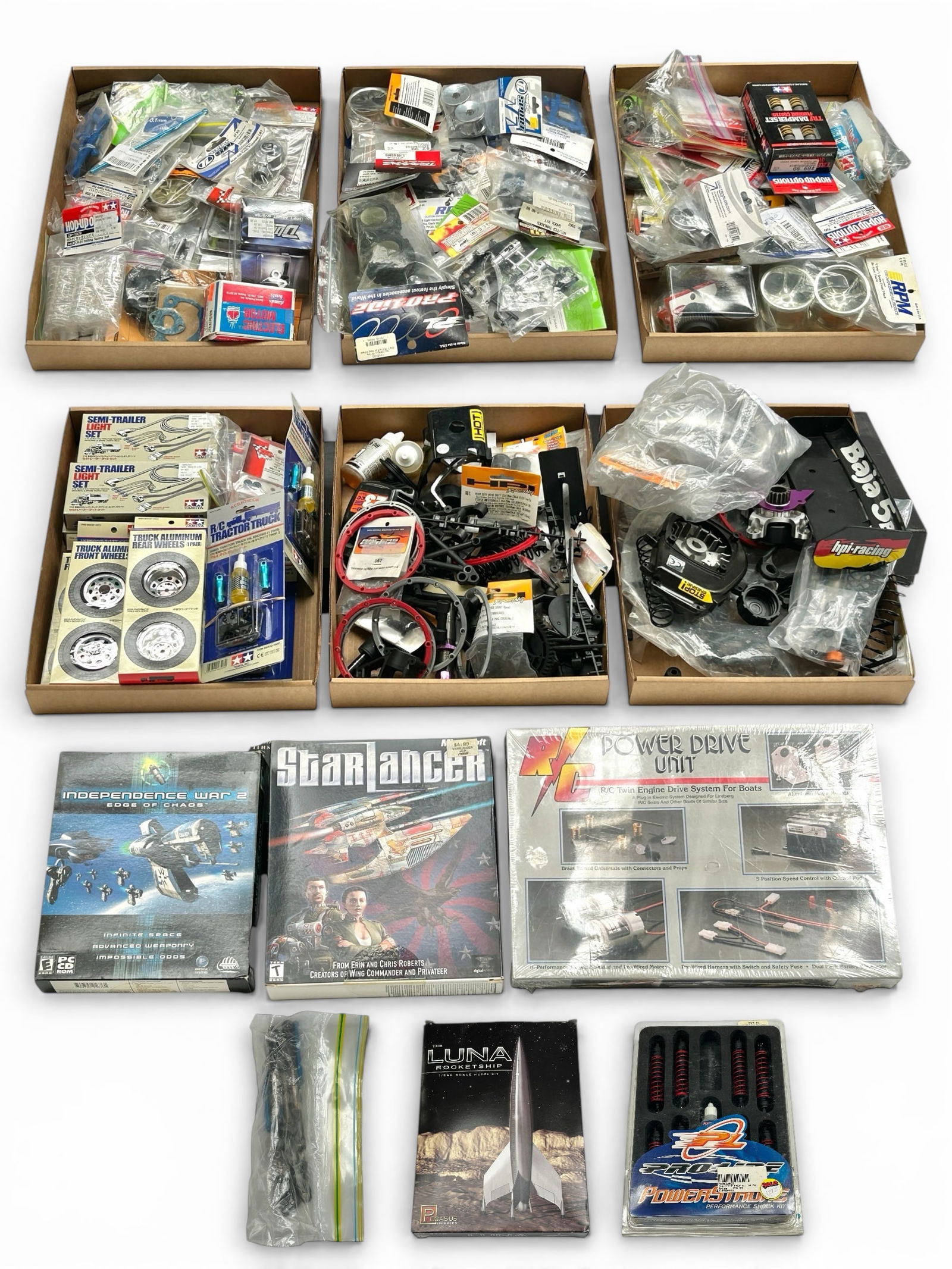 Lot of RC Parts and Accessories, Some Sealed.: Included are the following remote control brands: Tamiya, Axial, RPM, HPI, and more. The largest box measures 14 3/8" x 10 3/8" x 1 3/4". The smallest package measures 5" x 3 1/4" x 1/8". In-house