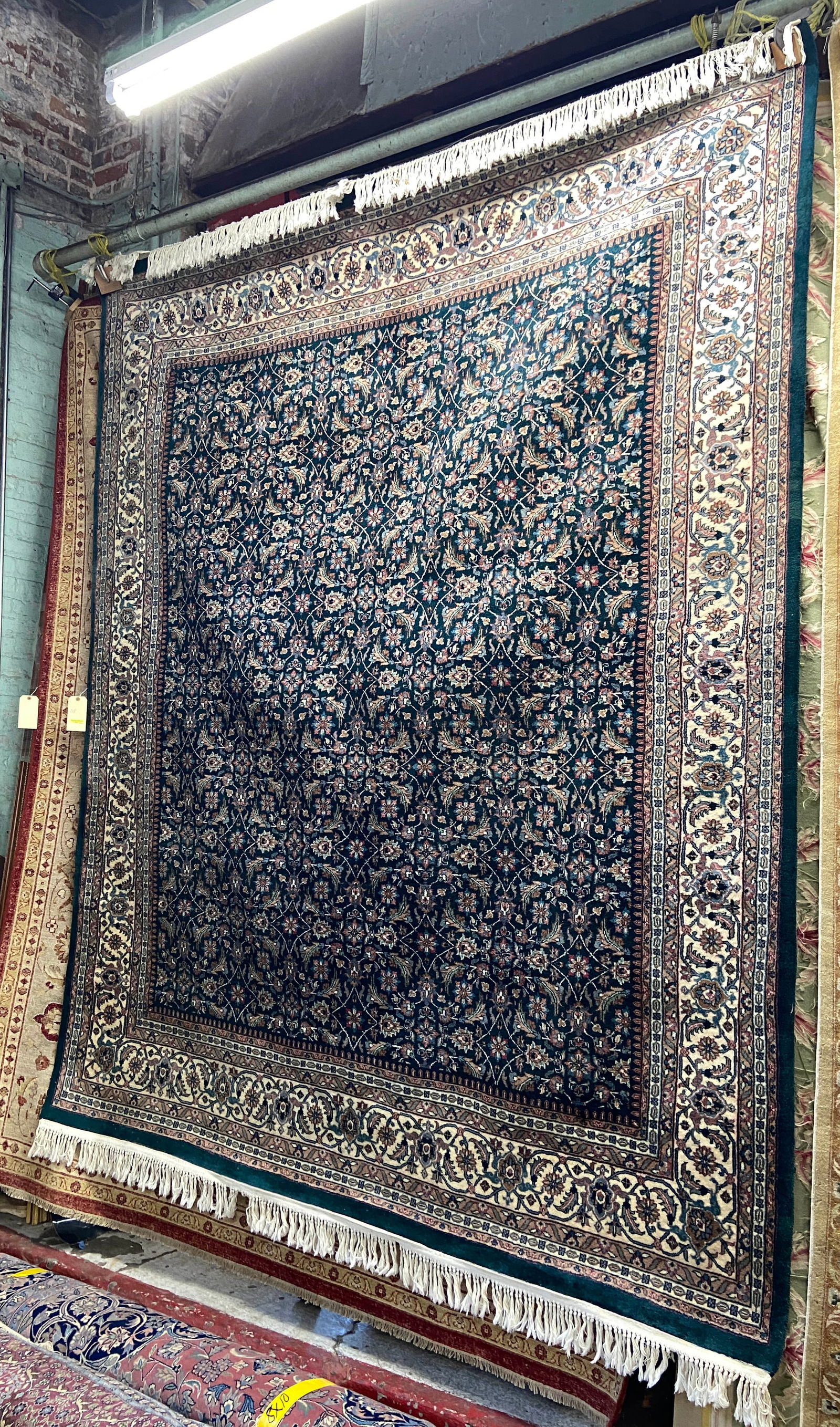 9' 6" x 8' 1" Blue Oriental Hand-Knotted Rug.: The rug looks to be in reasonably good overall condition. In-house shipping is available for this rug. Please see our website regarding our in-house shipping procedures.