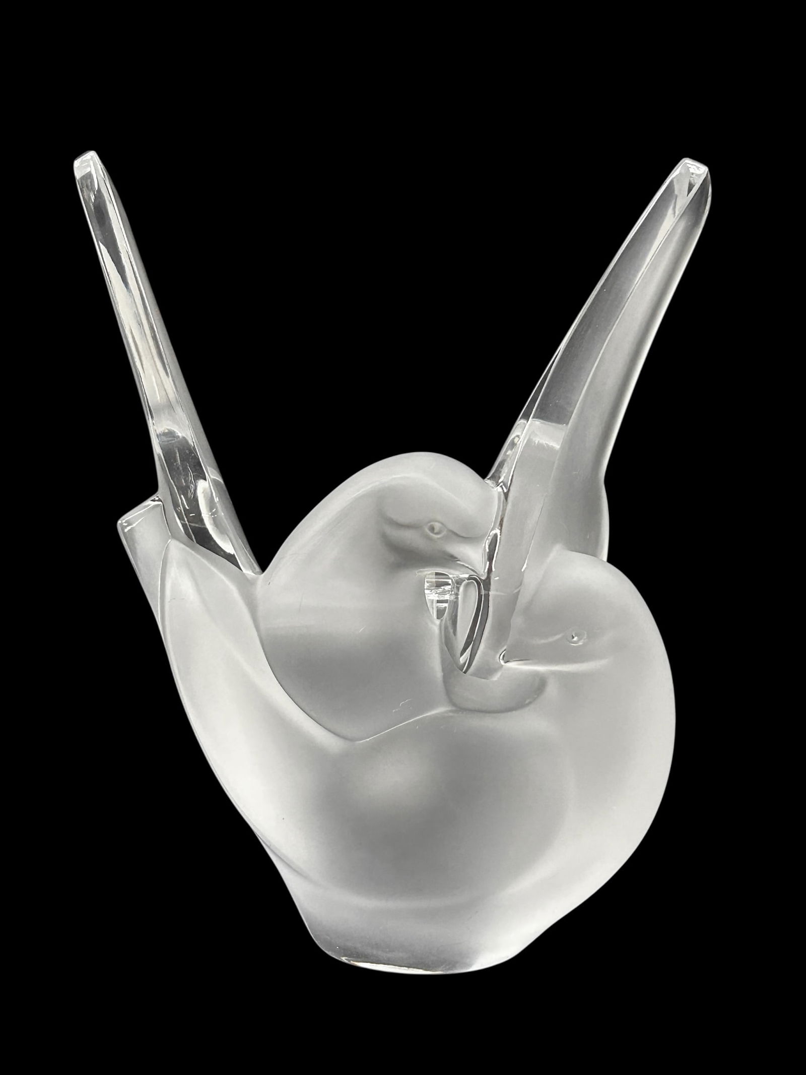 Lalique France "Sylvie" Frosted Dove Vase.: It comes with a fitted flower frog. The vase resembles a pair of doves with outstretched wings. The dimensions are 7 1/4" x 4 1/4" x 9". In-house shipping is available. Please see our website regardin