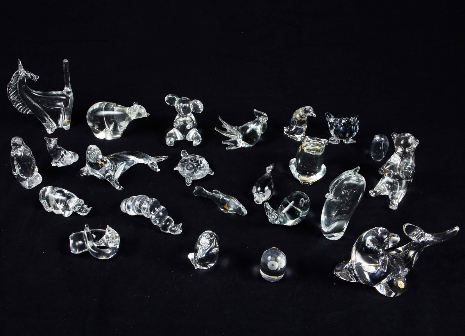 Lot of Animal Crystal Figurines- Steuben, etc.: Most are unsigned. The lot includes Val St. Lambert, Steuben, several animals made in Sweden, and more. The lot looks to be in nice condition. The largest animal measures 7 3/4" x 3 1/2" x 5 1/4". The