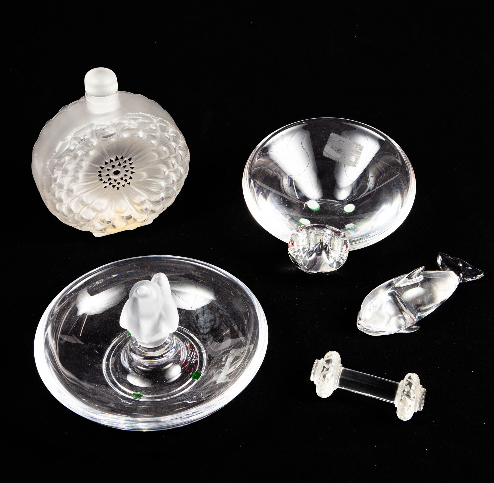 Lot: 5 Crystal Pcs.- Lalique, Steuben, Sevres.: The lot includes the following: a Lalique Dahlia perfume bottle, a Lalique knife rest, a Steuben tilted bowl, a Sevres bowl with a frosted bird in the center, and a Hadeland whale paperweight. Overall