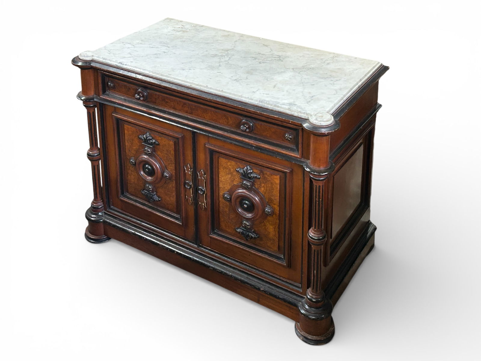 Antique French Revival Style Marble Top Server.: This burled walnut and ebonised commode has a white marble top, one upper drawer, and two doors with interior storage. It features fluted columns, as well as carved details on the panelled doors. The