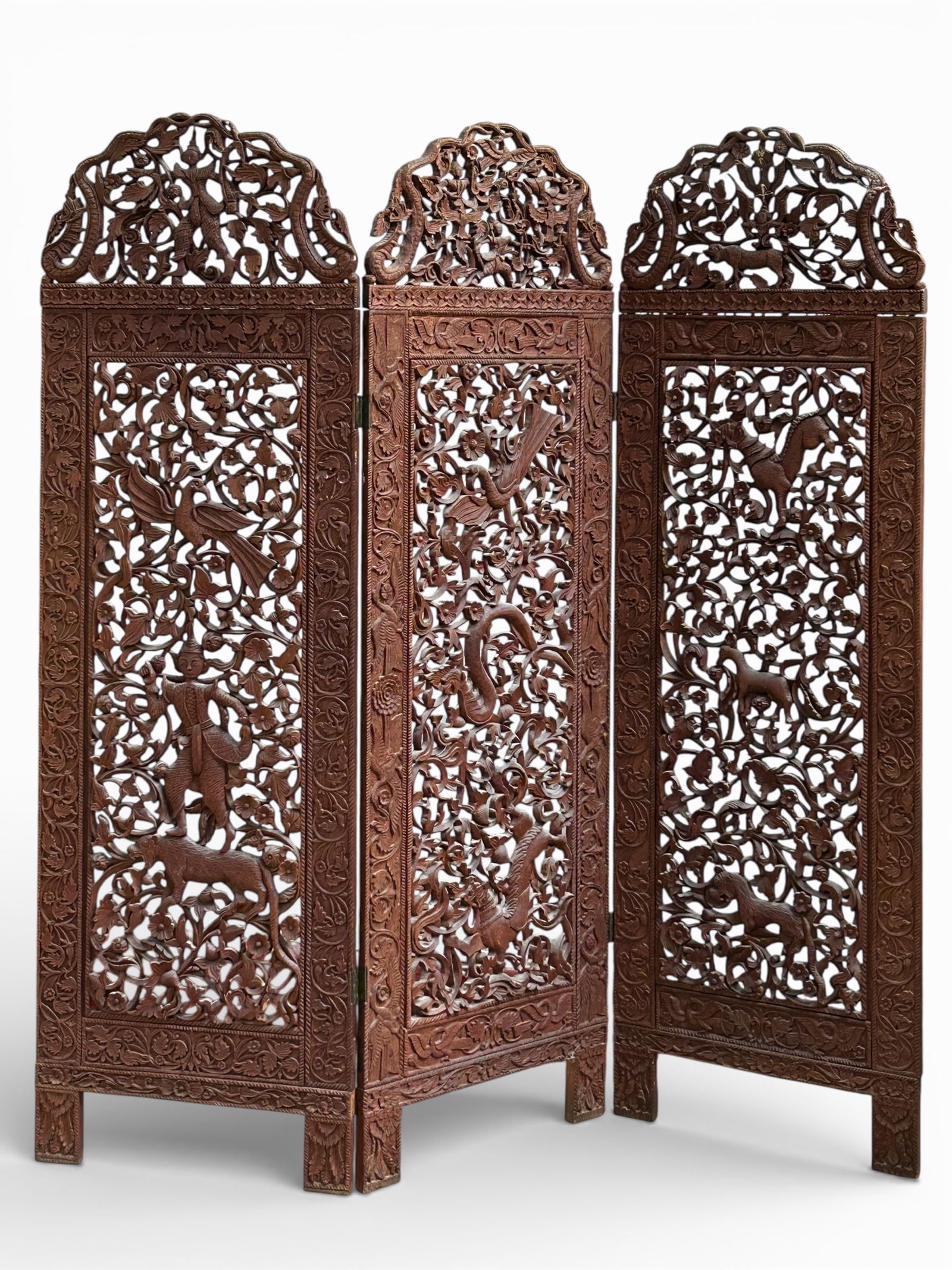 Ornately Carved Thai Screen.: This unusual ornate three-panel screen has carved details of people, flowers, animals, birds, and more. The top right panel has been repaired. Overall, it is in good condition. Each panel measures