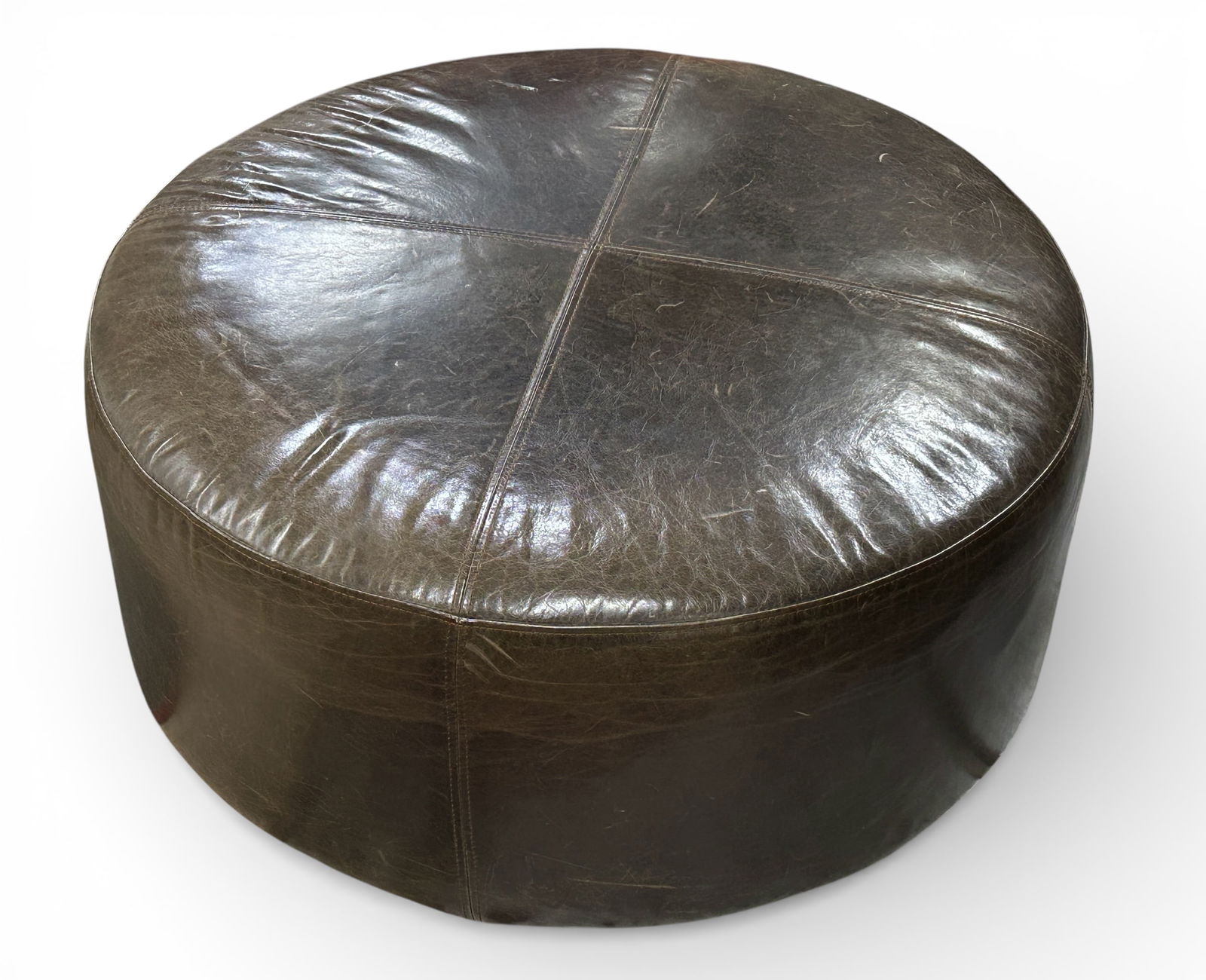 Restoration Hardware Leather Ottoman.: This fine quality ottoman has a cross stitched design and makes for a nice large footrest.. There are some scratches and wear marks. It measures 15" tall and 34 1/2" in diameter. Third-party freight