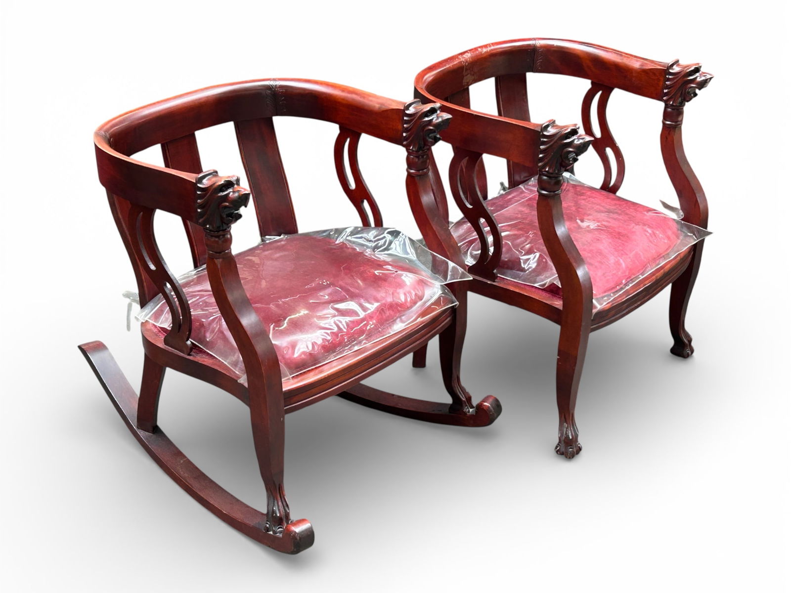 Antique Carved Lion Head Rocker & Chair.: Both the mahogany chair and matching rocker have barrel backs, upholstered seats (either velvet or mohair), carved lion heads, and paw feet. The chair has some stains on the wood, but both are in