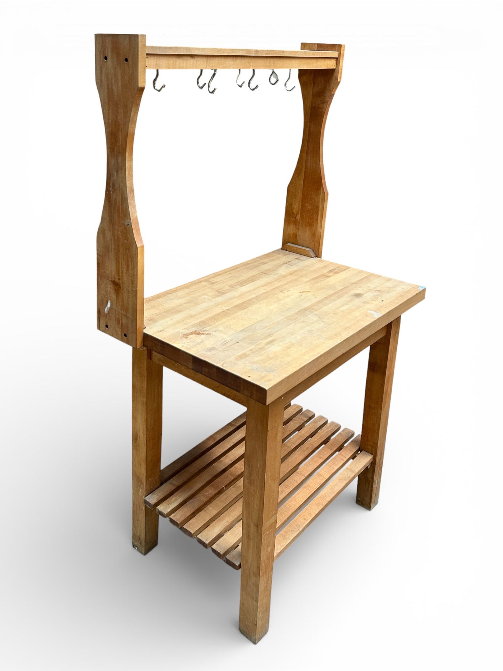 Potting Bench or Work Table.: The table has a lower slat shelf, and hooks above the shelf for hanging. It is in good condition, with some stains. The table measures 36" wide, 24" deep, and 66" tall. Third-party freight shipping