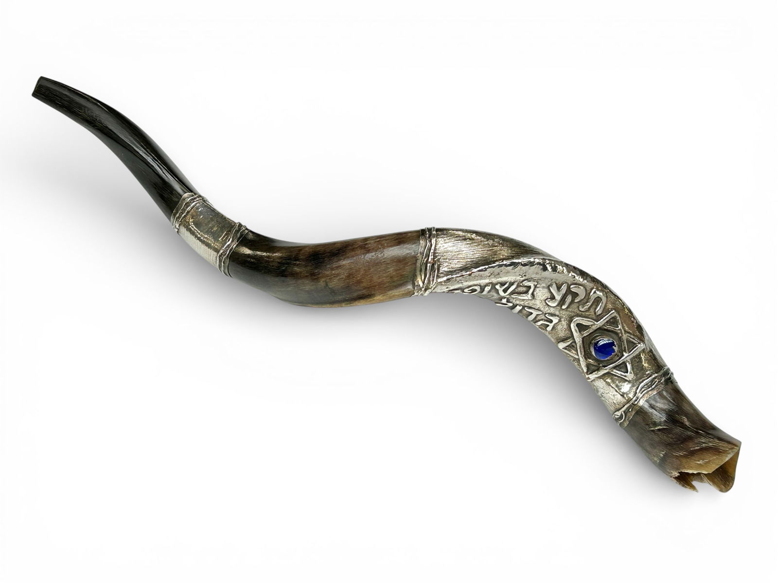Jewish Sterling Silver Ram's Horn Shofar, Israel.: The ceremonial horn is marked S.C. 925 Israel on the largest silvered section. This section features Hebrew writing, Stars of David, and blue jelly belly jewel. The horn measures 23" long, 6" wide, an
