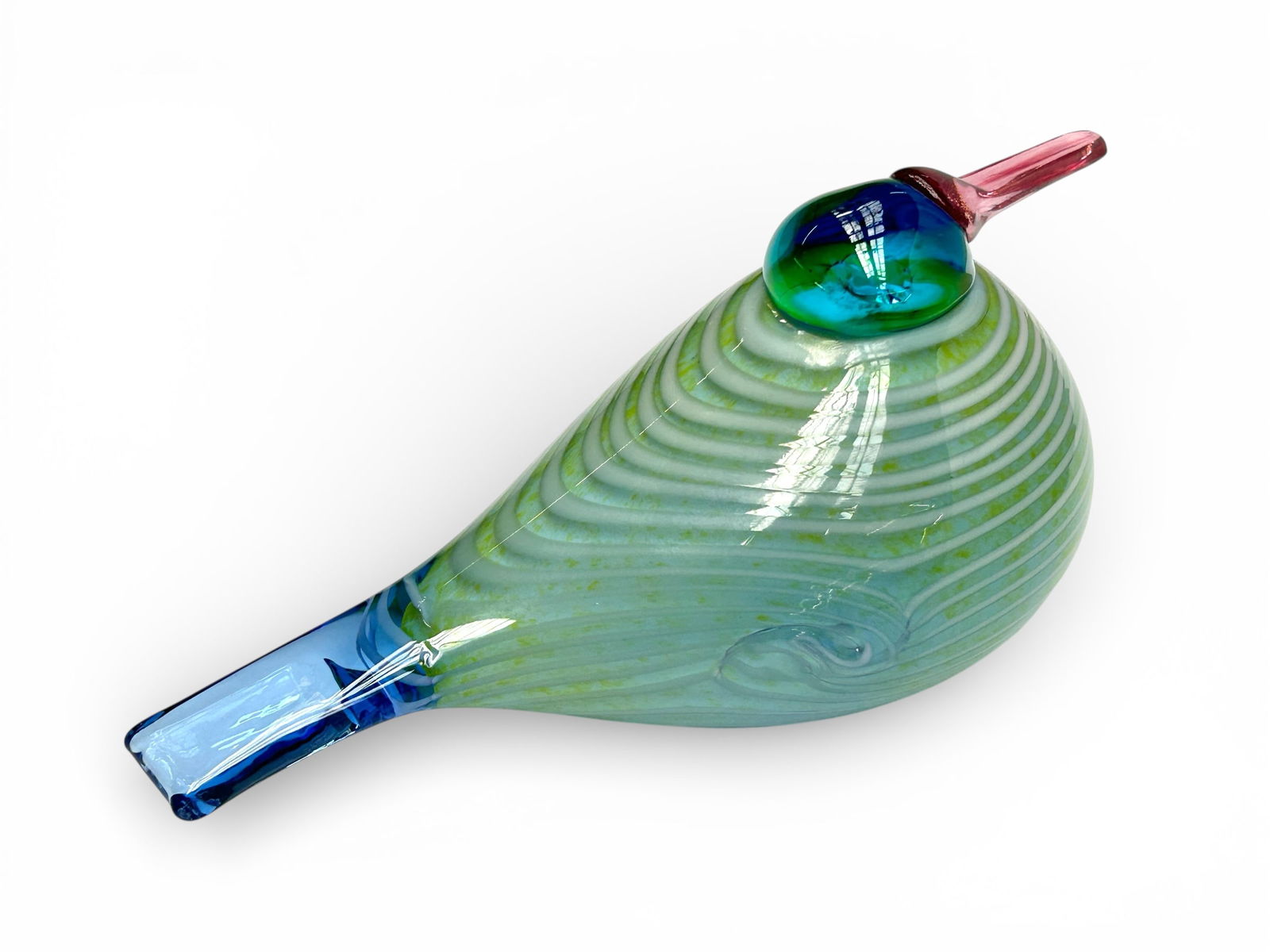 Oiva Toikka for Iittala Glass Rainbow Bird.: This signed Oiva Toikka glass bird was made in Finland, originally released in 2007. It still has part of the original retail sticker attached. The bird's colors are blue, yellow, green, and white, wi
