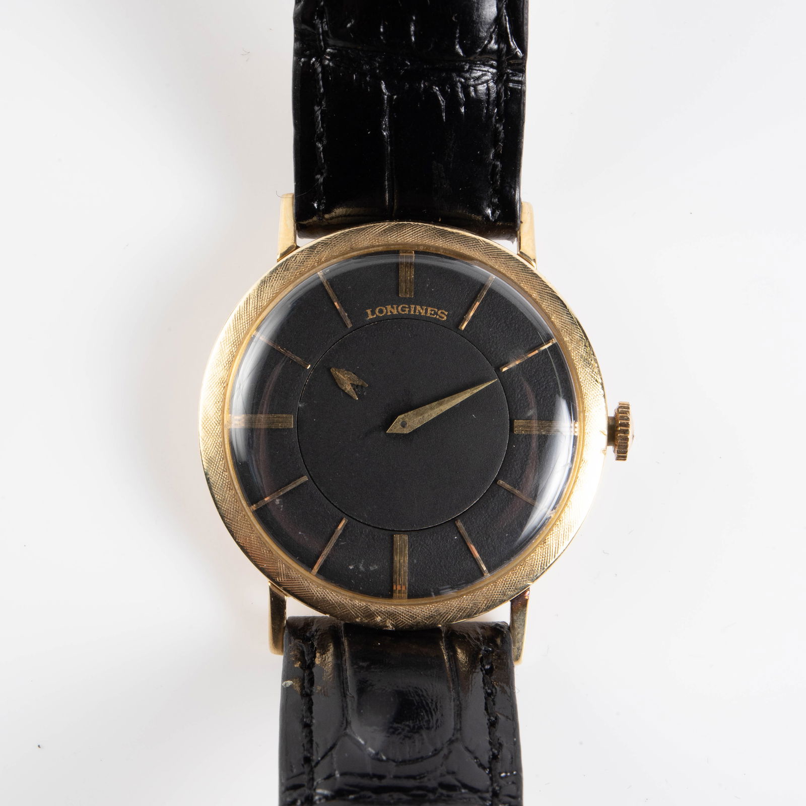Vintage Longines 14K Yellow Gold Watch.: This vintage watch is marked 14K Gold on the back of the case. The case measures 33mm in diameter. The watch ticks. It weighs 17.6 Pennyweight, or 27.3 Grams (including the band, movement, and crystal