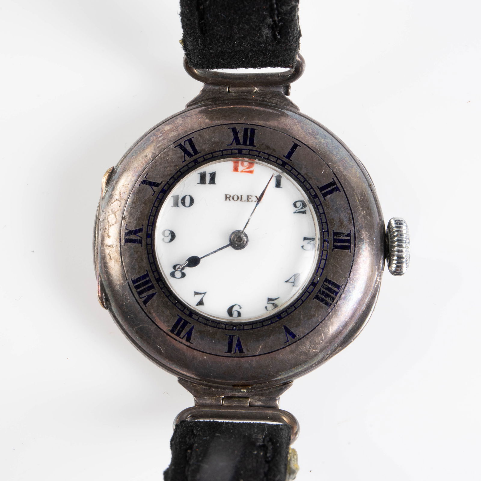Antique Sterling Rolex Demi Hunter Trench Watch.: The sterling silver watch has both Roman and Standard or Arabic numerals. The back of the case is marked Rolex 925, and the movement is marked Rolex 15 Jewels. The watch has a black suede band. The ca