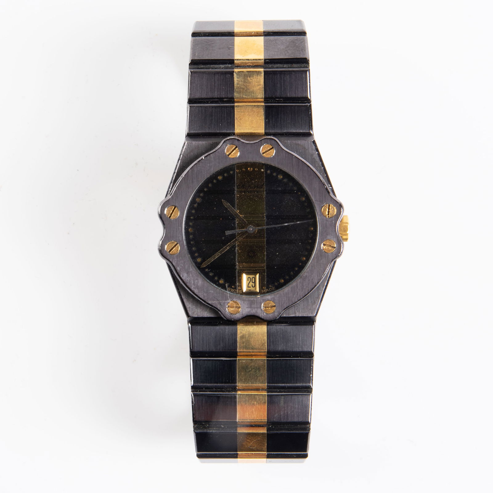 Chopard St. Moritz Watch - Black & Gold Tone.: The vintage quartz two-toned date watch likely needs a new battery. The case measures 31mm in diameter. There are some scratches and stains on the piece. Otherwise, it is in overall good condition. In