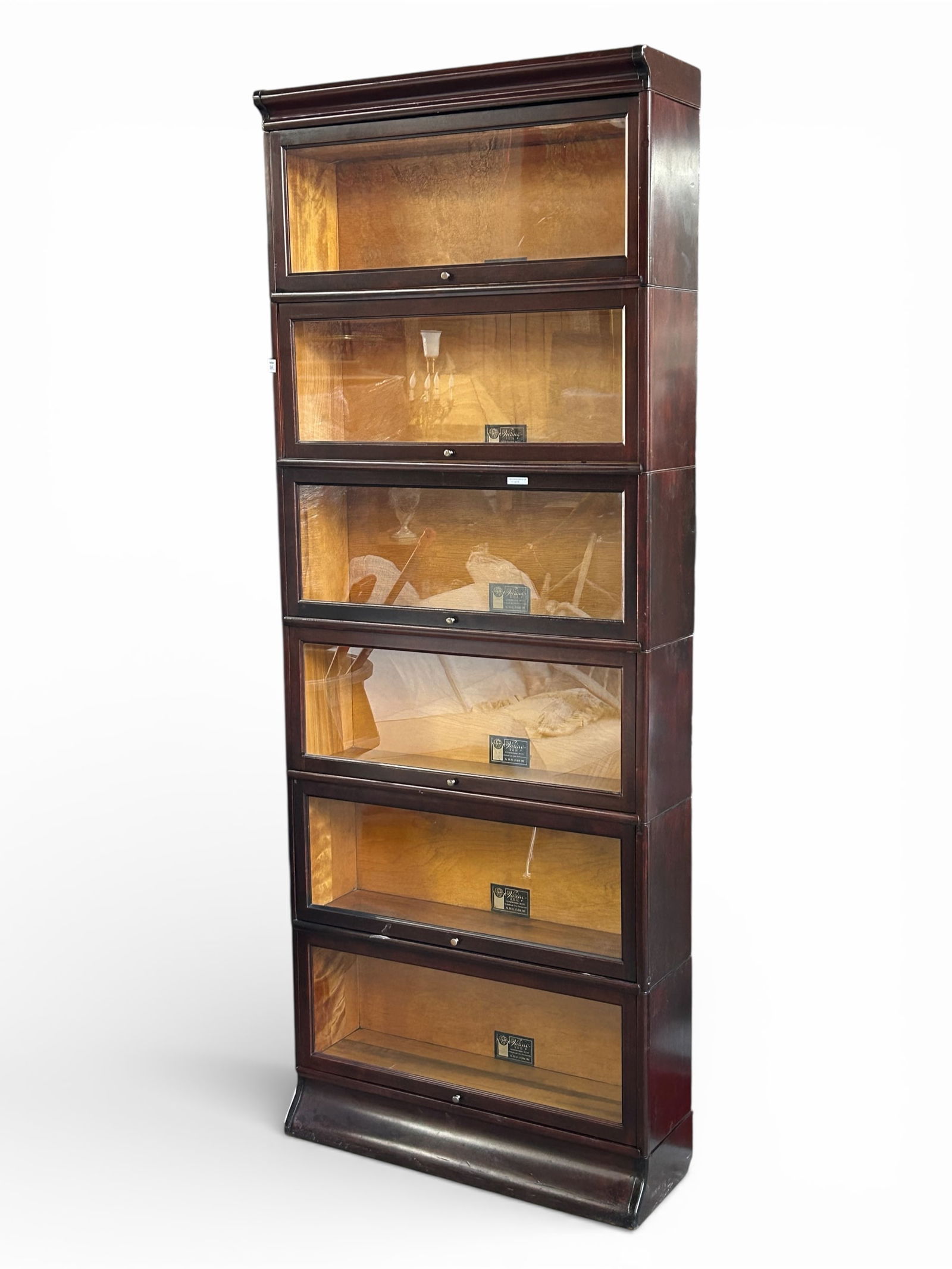 6 Tier or Stack Viking Mahogany Barrister Bookcase: This bookcase includes six Viking "No.930 AX-11 1/8 Book Units," as well as top and bottom pieces. One of the sections has a door that does not seem to properly slide into its "open" position, so it