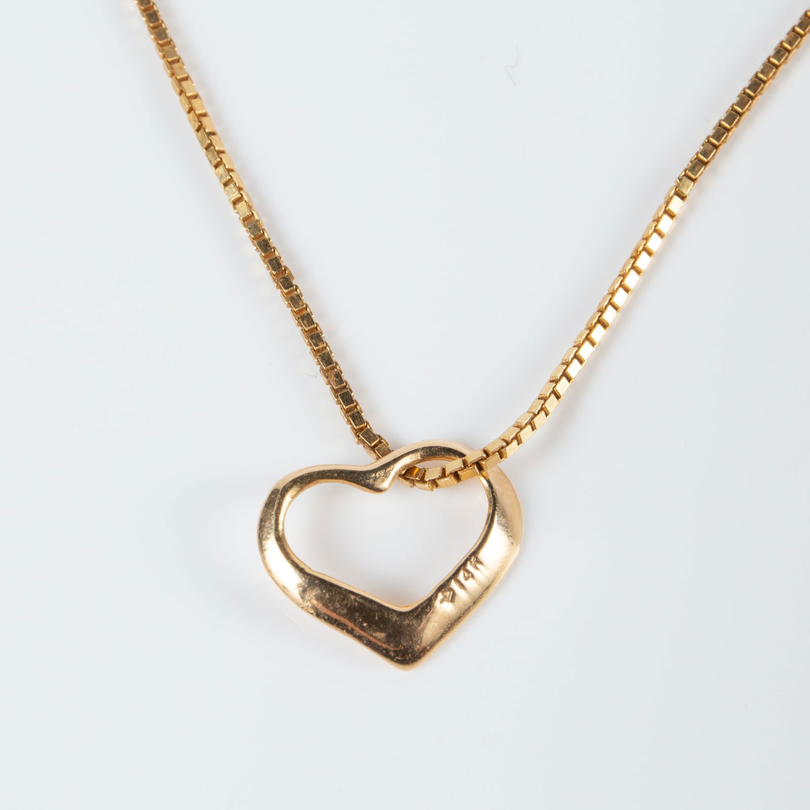 14K Yellow Gold Heart Necklace.: The chain is marked IL1-14KTP Israel, and the clasp is also marked 14K. The heart pendant is marked 14K. The thin box chain measures 17 1/2 long, and the pendant measures 11mm x 12mm. The item weighs