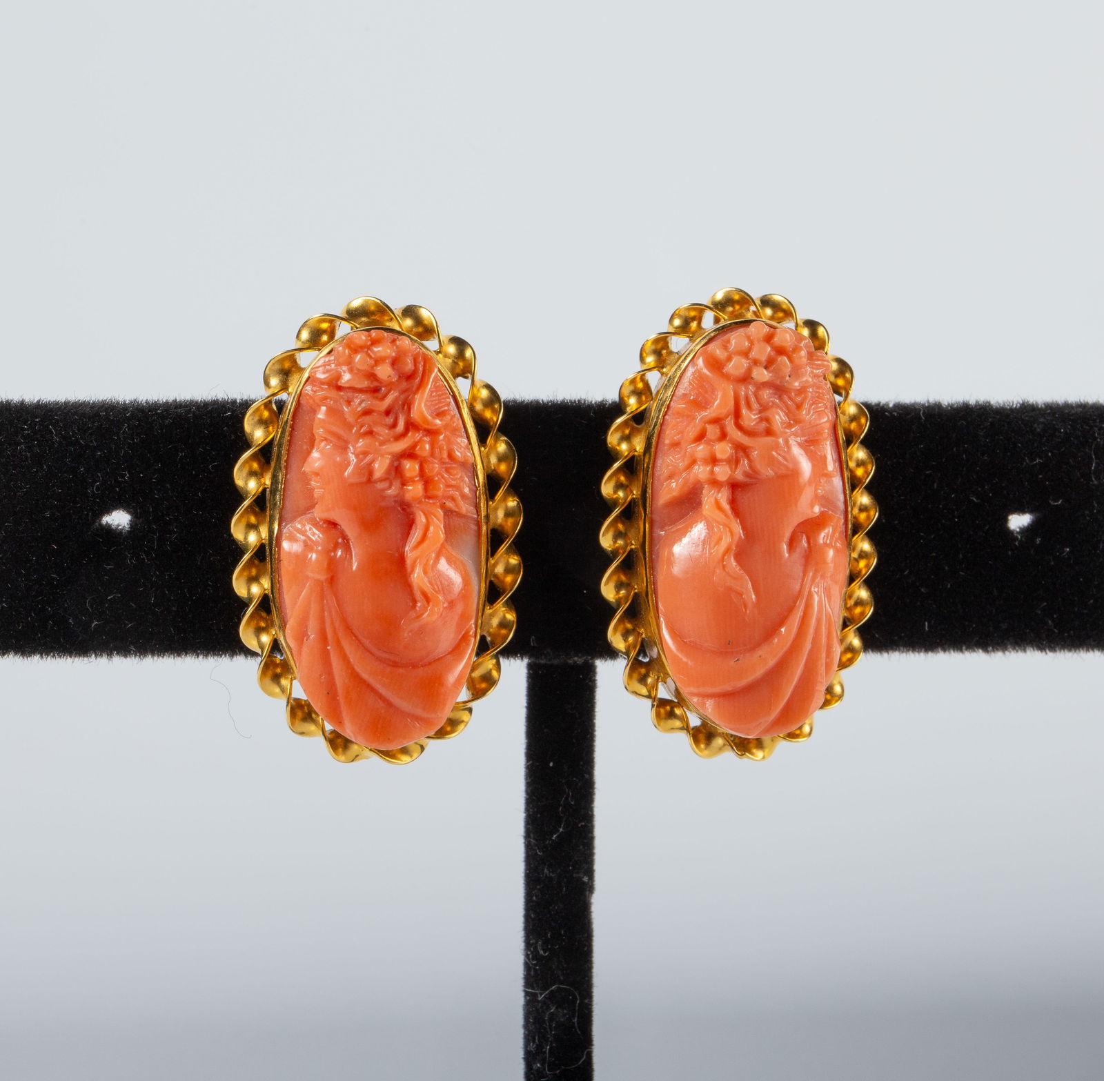 14K Yellow Gold Earrings w/ Carved Coral Cameo: The screw back earrings are marked 14K on the backs. They measure 25mm x 14mm. The pair weighs 5.3 Pennyweight, or 8.2 Grams (including the cameos). They are in overall very good condition. In-house s