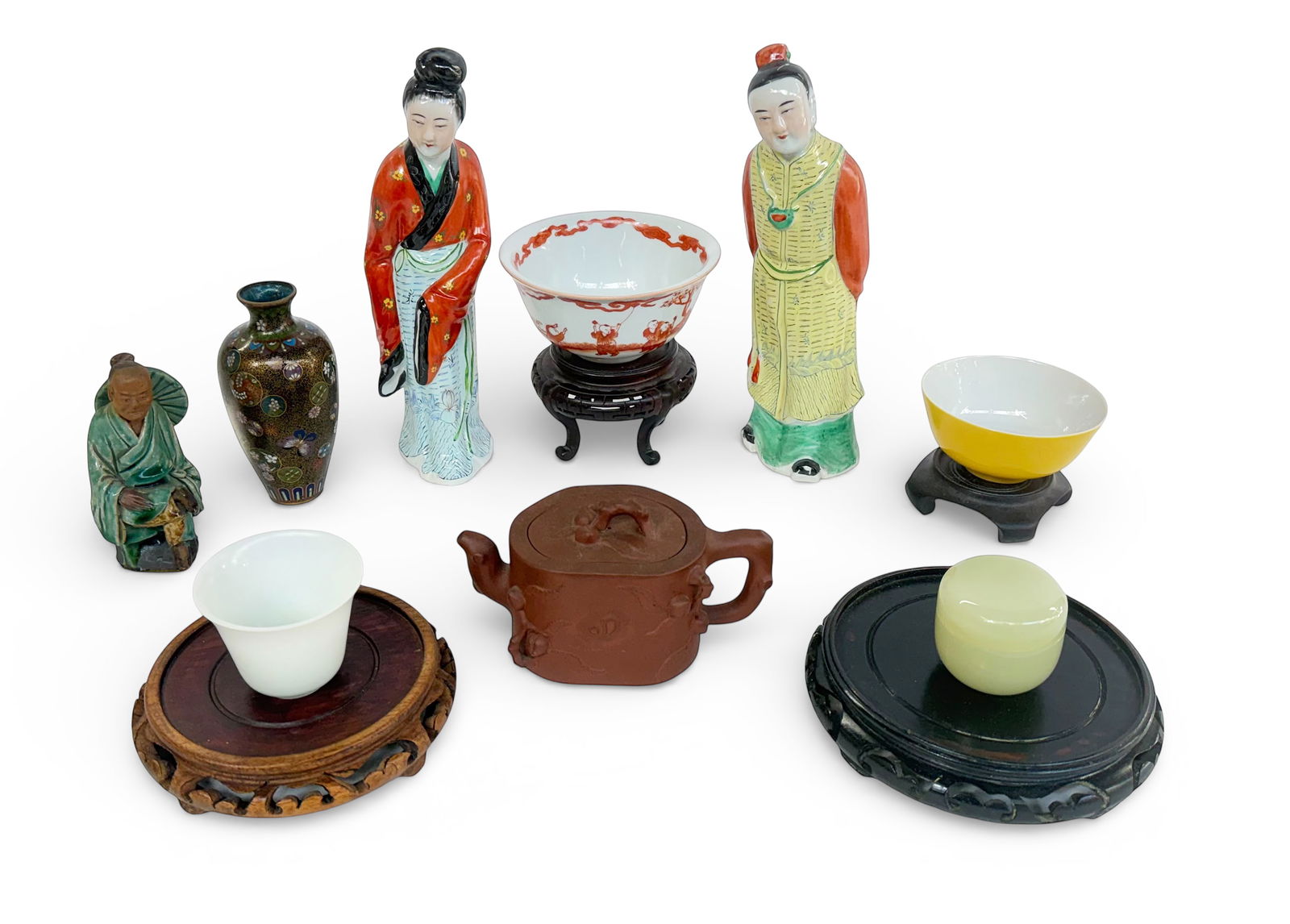 Lot of Assorted Asian Articles - Mostly Chinese.: The lot includes an old Japanese cloisonne vase (some enamel loss), a signed yixing clay teapot (3 small chips on lid), a mudman, a small glass jar, several carved wood stands, two porcelain Chinese f